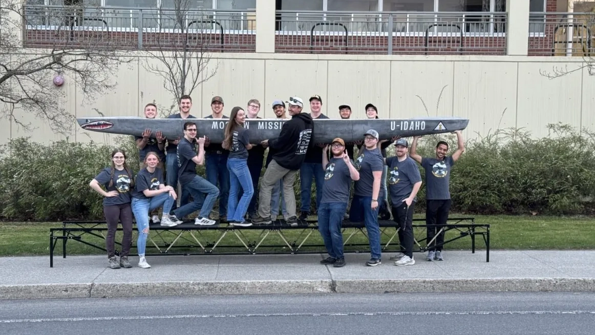 CEE students standing in front of a missile