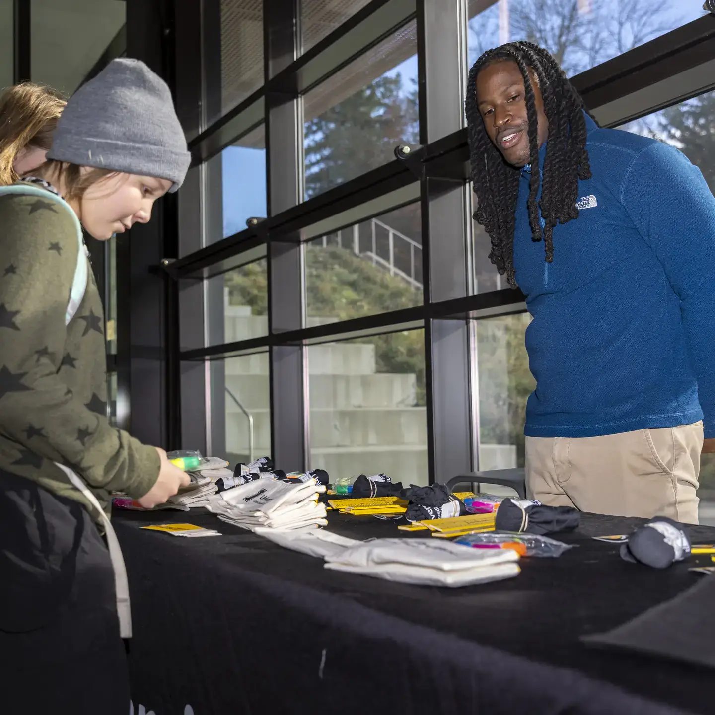 Education doctoral candidate Lorenzo Rene staffs the Dual Credit Program table during Vandal Science Day at the Integrated Research and Innovation Center (IRIC) on Friday, November 7, 2025. As the first graduate of University of Idaho’s Dual Credit Certificate in education, his goal is to teach college credit courses in high school while making sure his students have everything they need to thrive. 