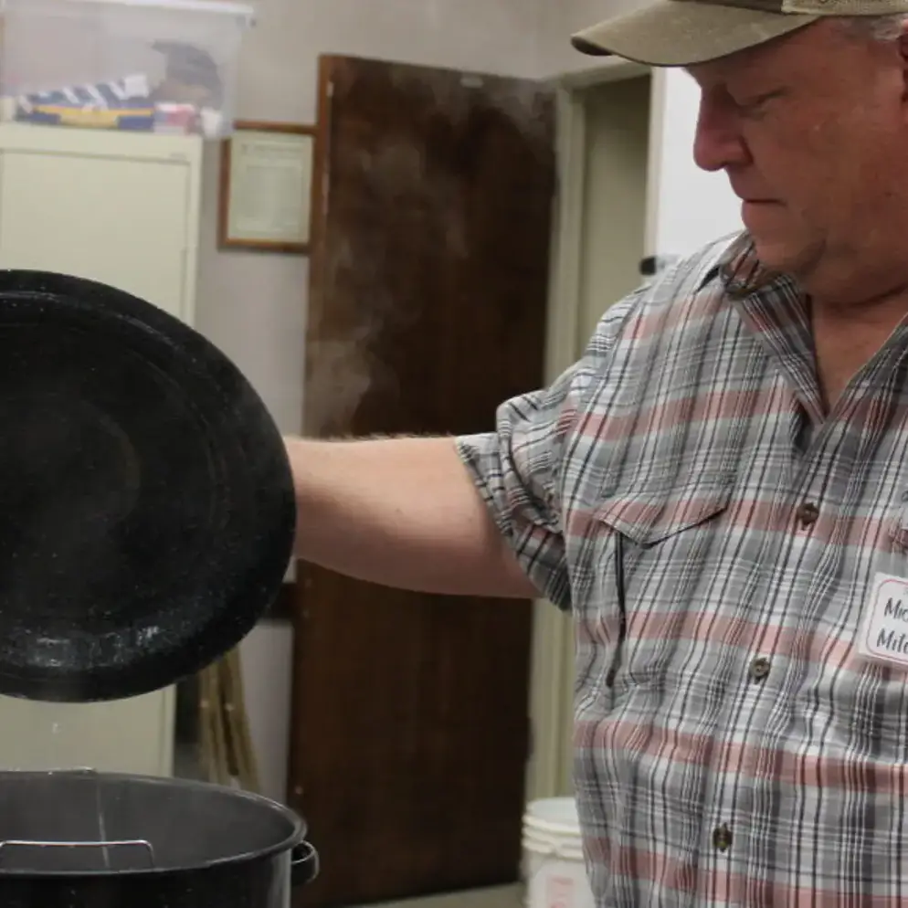 UI Extension Master Food Safety Advisor Michael Mitchell demonstrates boiling water canning during an in-person Extension food safety and preservation program