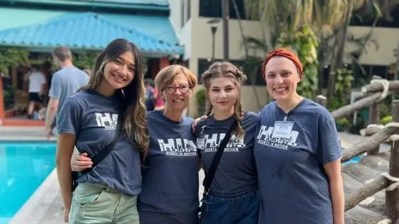 A team of four women pose for a photo in Guatemala