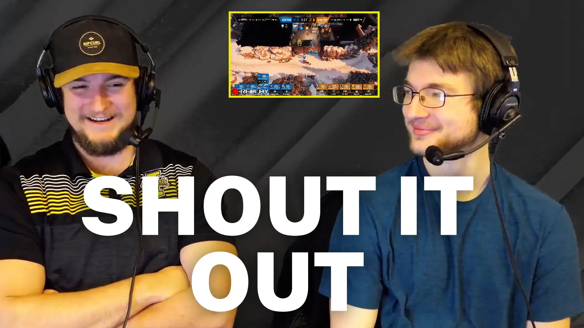 Two men on screen wearing headsets with video game image in-between them.