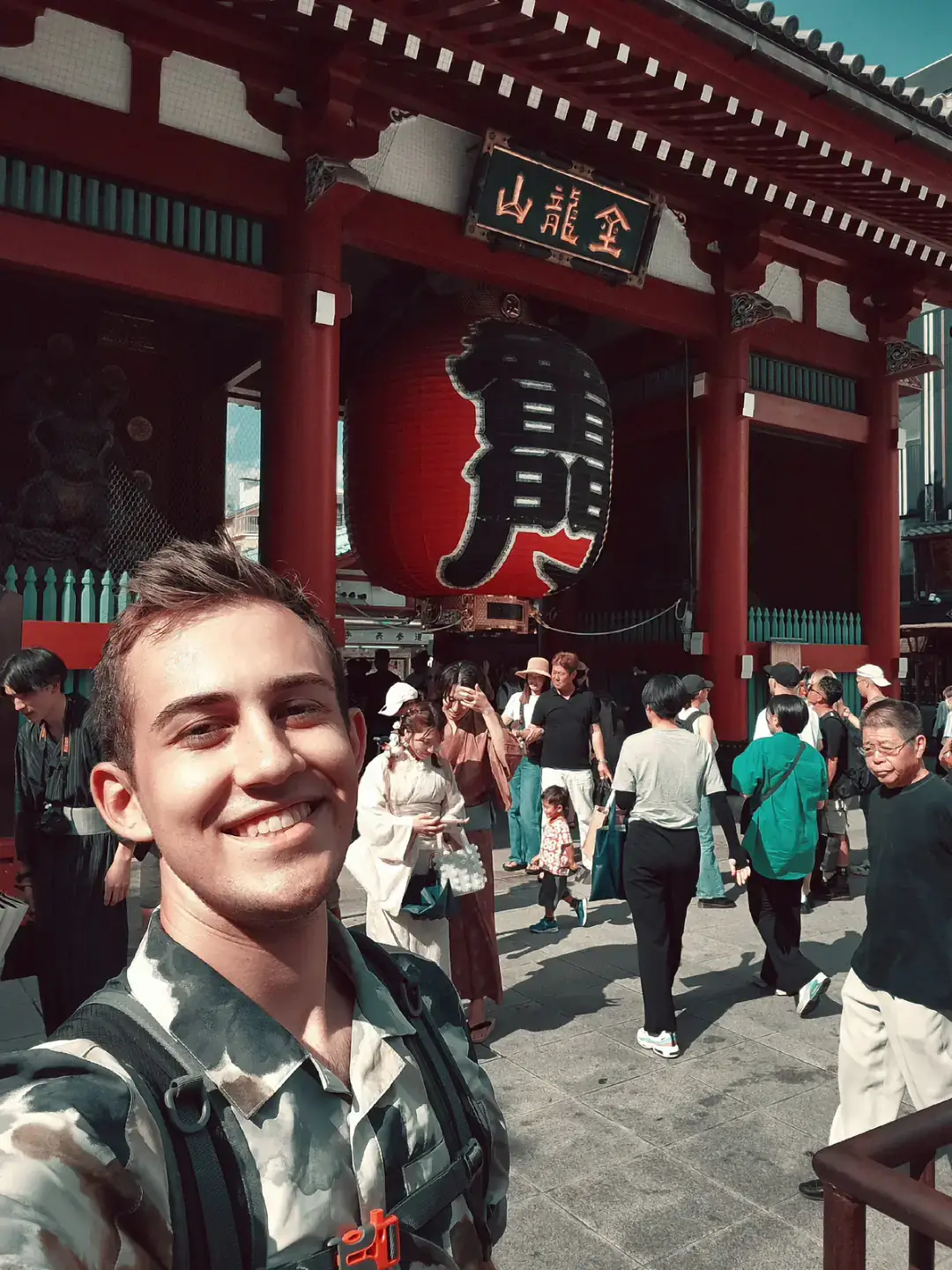 Shane Neirinckx smiles in a selfie at Sensō-ji, a temple in Tokyo