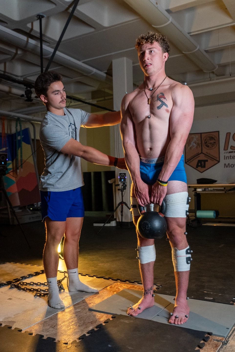 Jared Hanchey does movement science research with Joshua Bailey on Wednesday, June 11, 2025 at the Integrated Sports Medicine Movement Analysis Laboratory in the Physical Education Building. Hanchey is studying the effects of isometric and generalized warmups for deadlift performance.