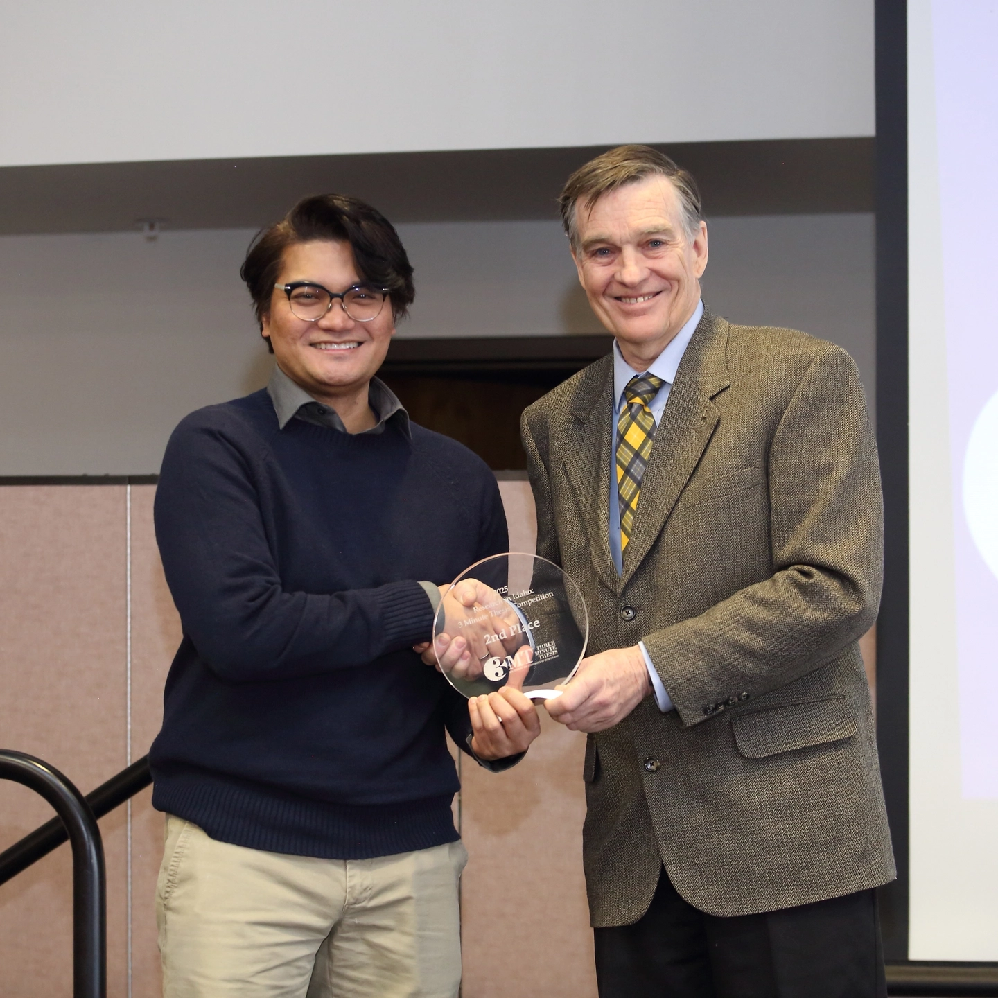 The Three Minute Thesis (3MT) 2025 Statewide Ӱֱ Competition is held in the Bennion Student Union Building at the Ӱֱ - Idaho Falls campus on Tuesday, February 11, 2025.

Graduate students from Ӱֱ, Boise State University and Idaho State University compete annually in the 3MT statewide competition and present their research in just three minutes or less with only one slide. A panel of judges choose 1st, 2nd, and 3rd place, and the audience gets the chance to vote for the People's Choice Award.

Brian Tibayan is awarded first place for his thesis “Improv-ing Science: Bridging the Communication Gap”.