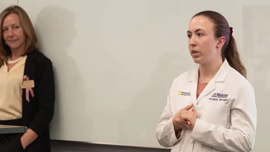 Reagan Badger speaks in front of a group