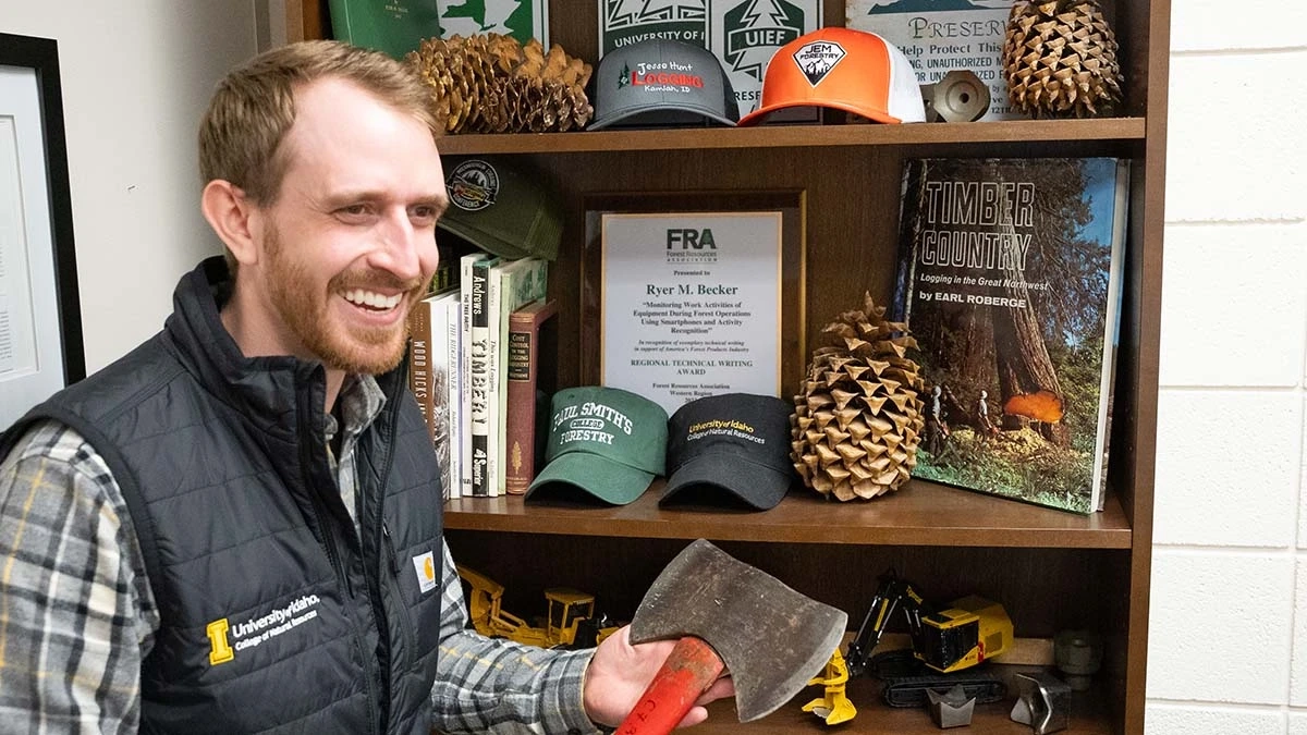 Portrait of Forest, Rangeland, and Fire Sciences faculty, Ryer Becker in his office with forest machine and tools memorabilia. Portrait of Forest, Rangeland, and Fire Sciences faculty, Ryer Becker in the office with a collection of forest machine and tools memorabilia.