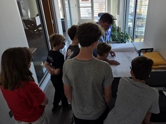 Children in classroom working on transportation assignment