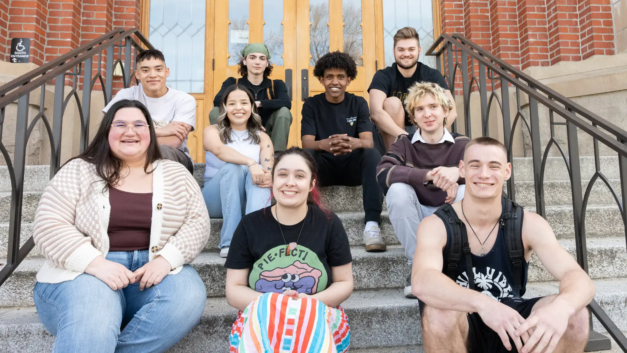 Group portrait of student ambassadors for the Vandals Gateway Program on the Administration Building steps.