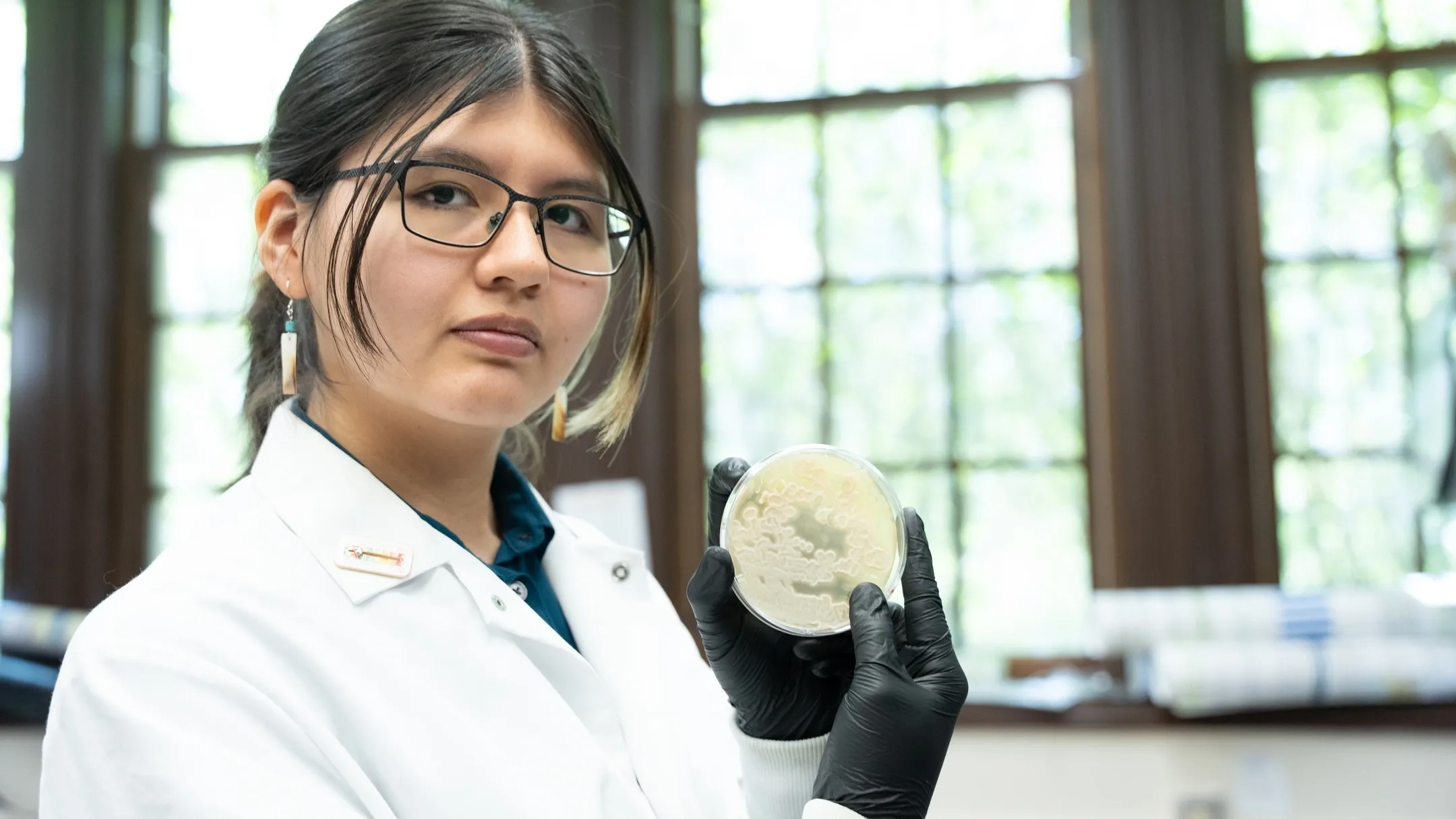 Goldwater scholar Dayna Bruiton from Caldwell, Idaho working in the Paul Rowley lab growing yeast in a petri dish
