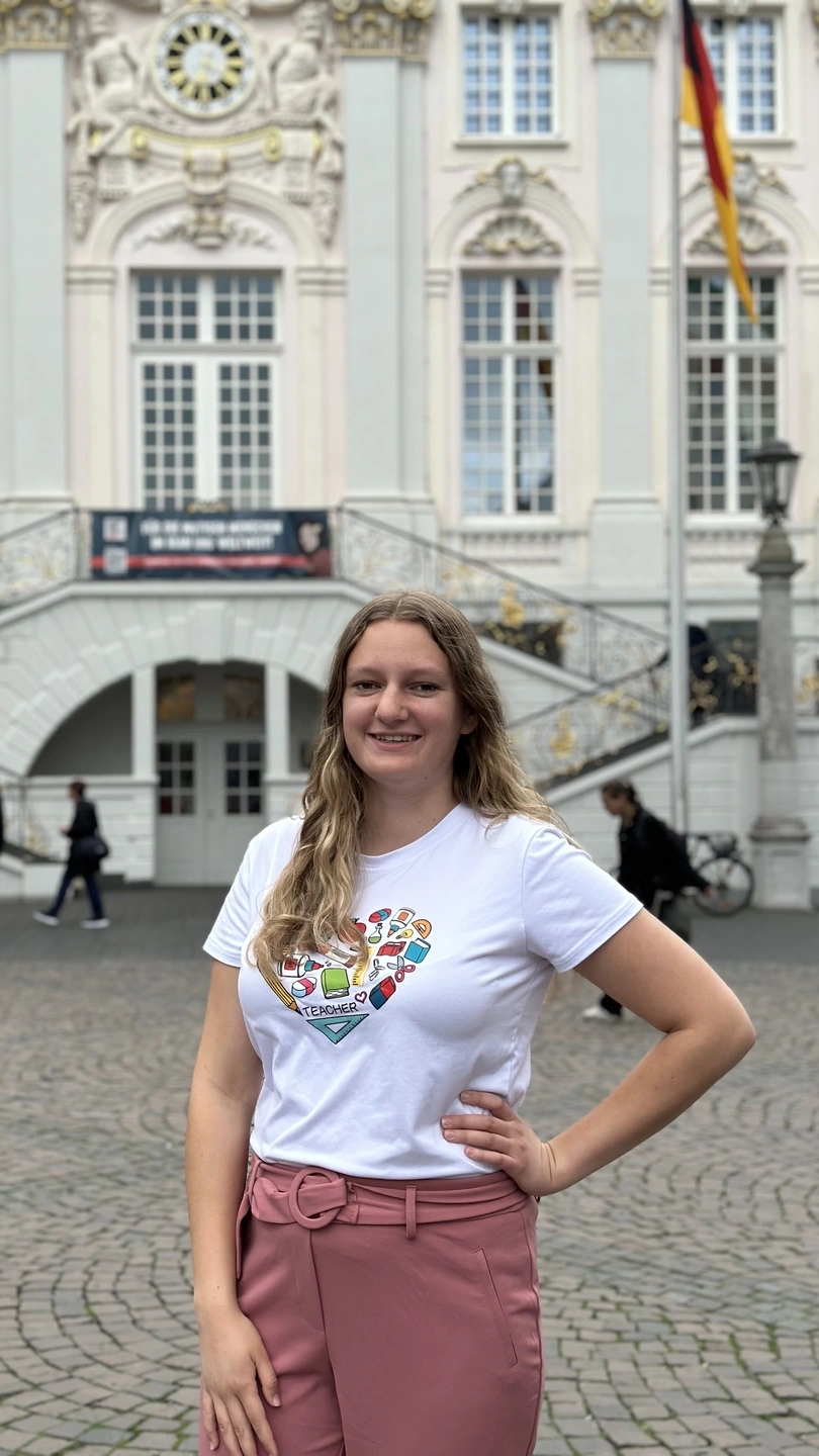 Christina Petrie standing outside of a foreign building
