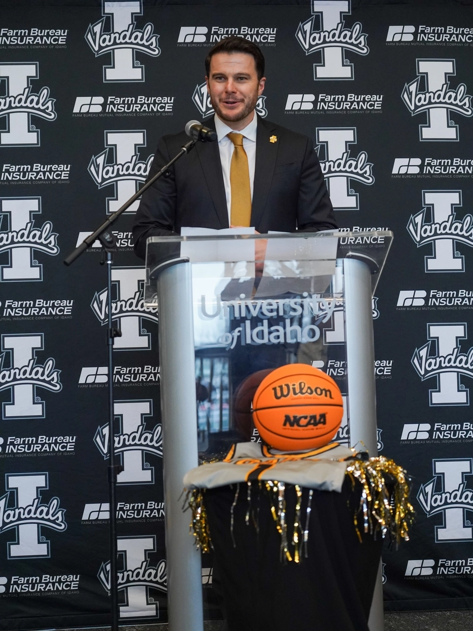 Basketball coach behind podium