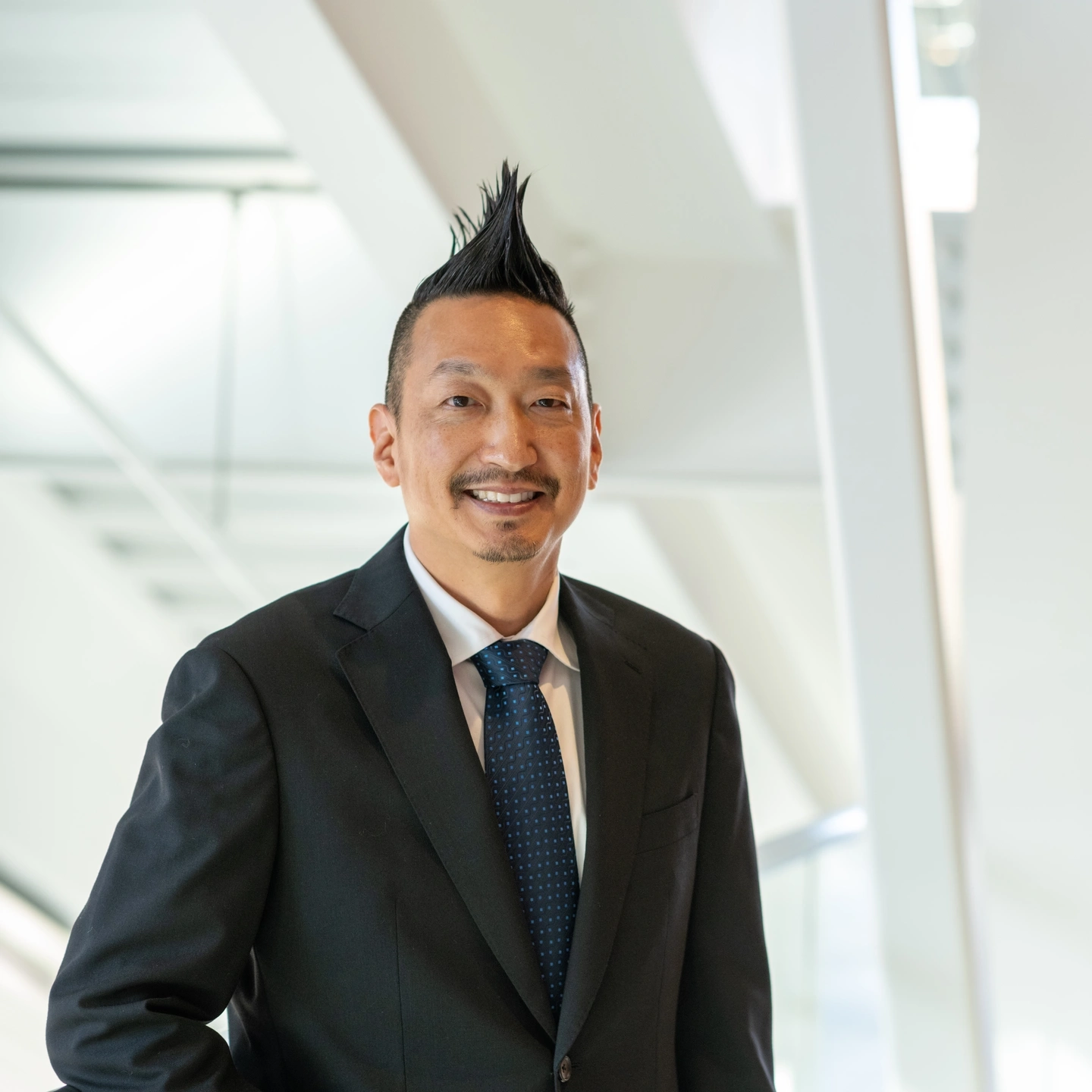 Portraits of Research and Economic Development VP, Chris Nomura.