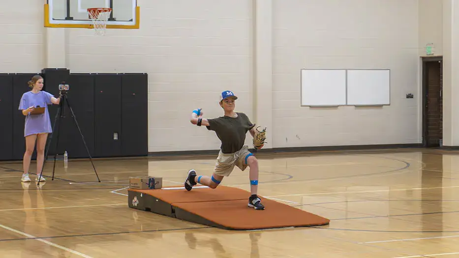 Study participant pitching a baseball