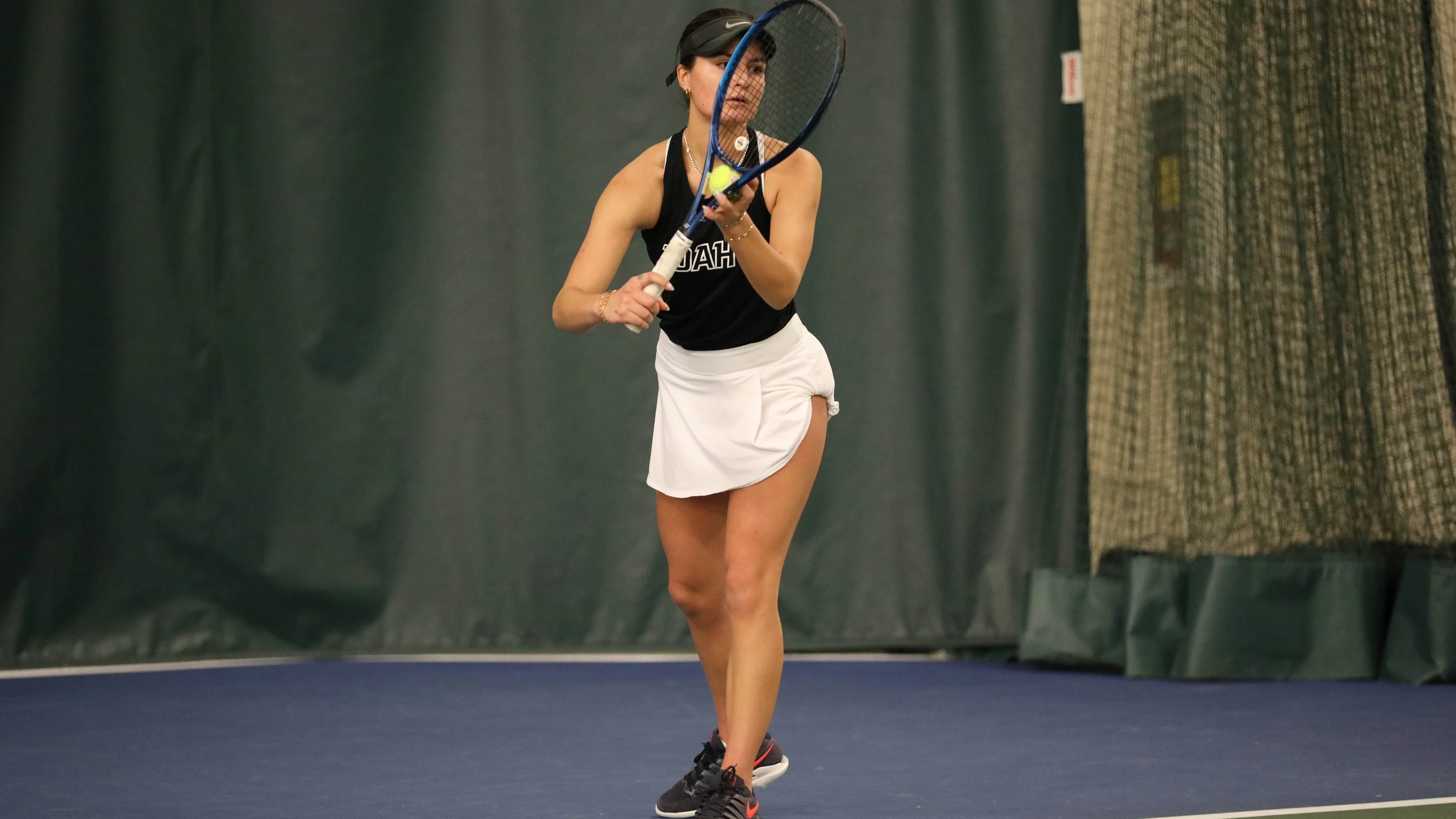 person getting ready to perform a tennis serve
