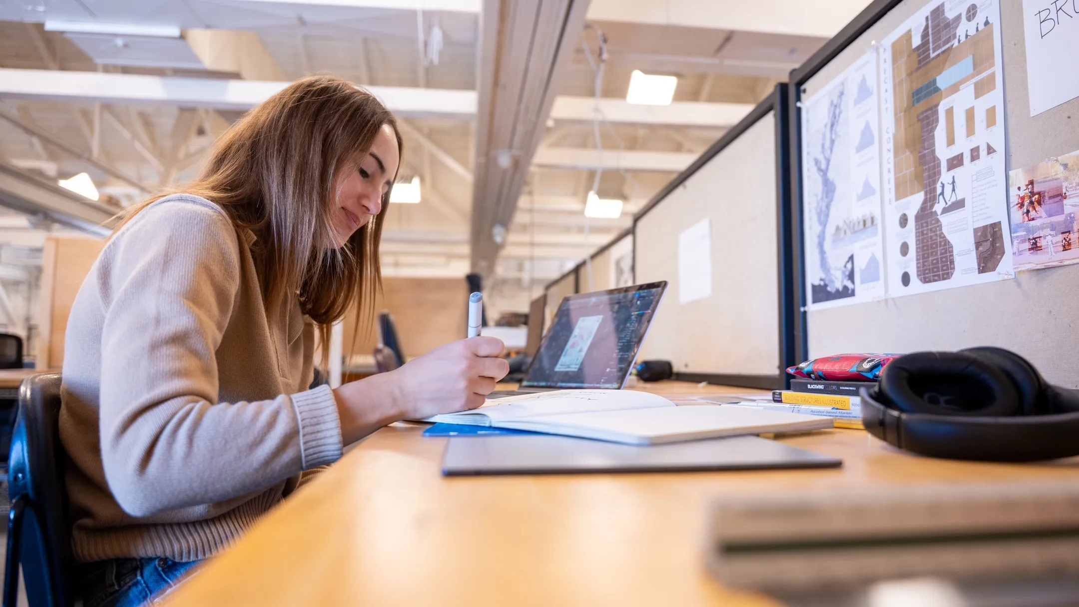Jenna Bruggeman is photographed in the Art and Architecture South Building for a CAA graduation story.