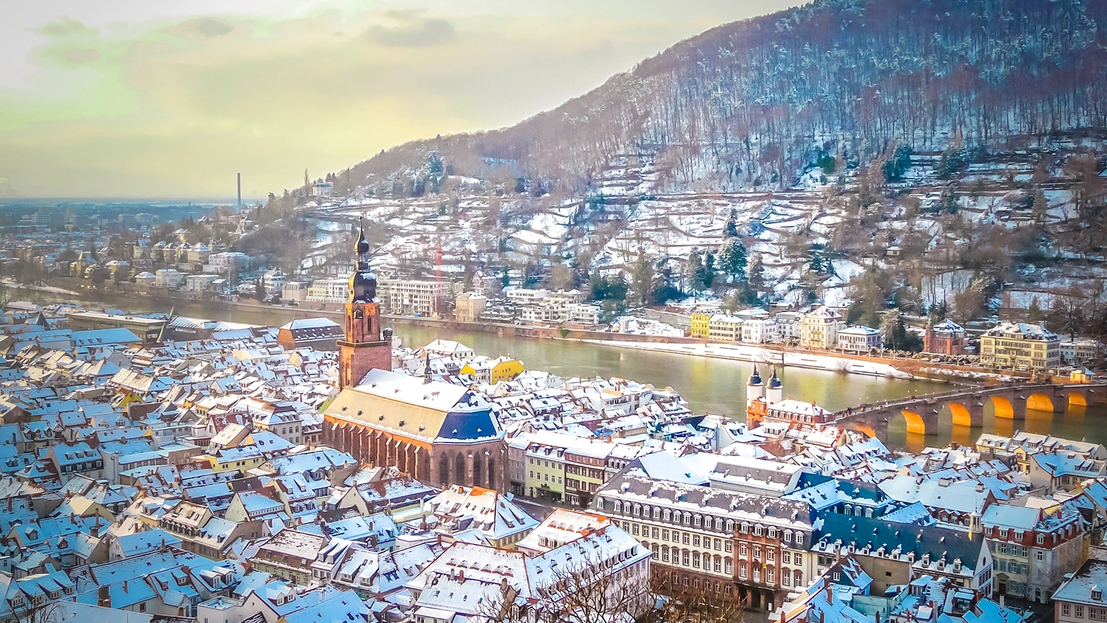Aerial view of Heidelberg town and Neckar river in winter with snow from the castle in the Baden-Wurttemberg region of southwest Black Forest in Germany during Christmas time