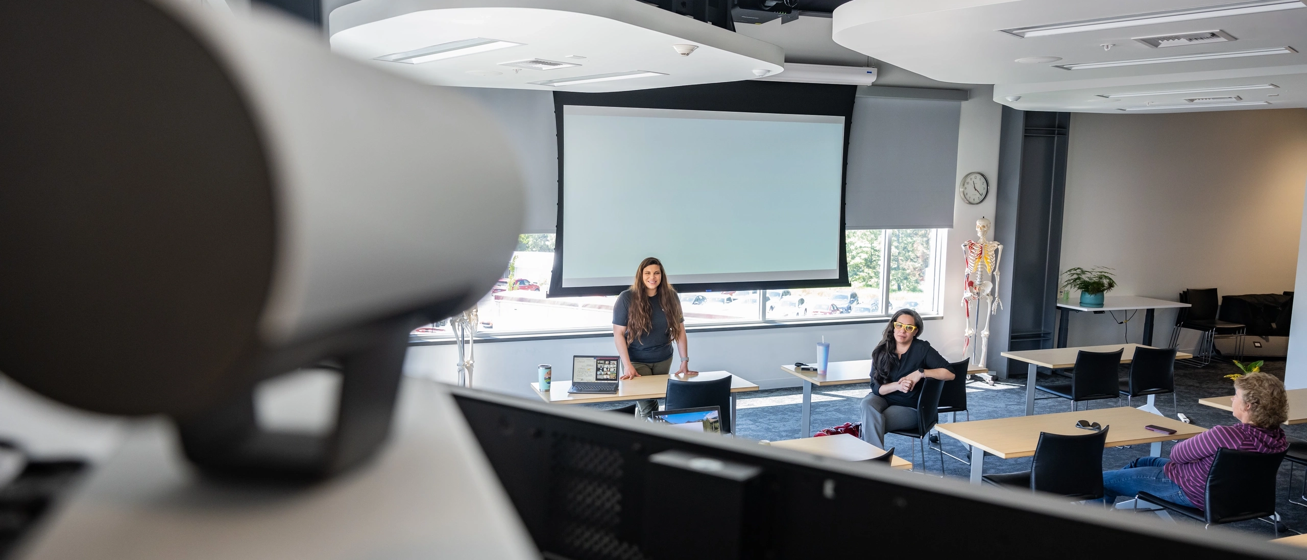 People interfacing with technology to illustrate the virtual education component of University of Idaho WWAMI Medical Education’s ECHO Idaho program.