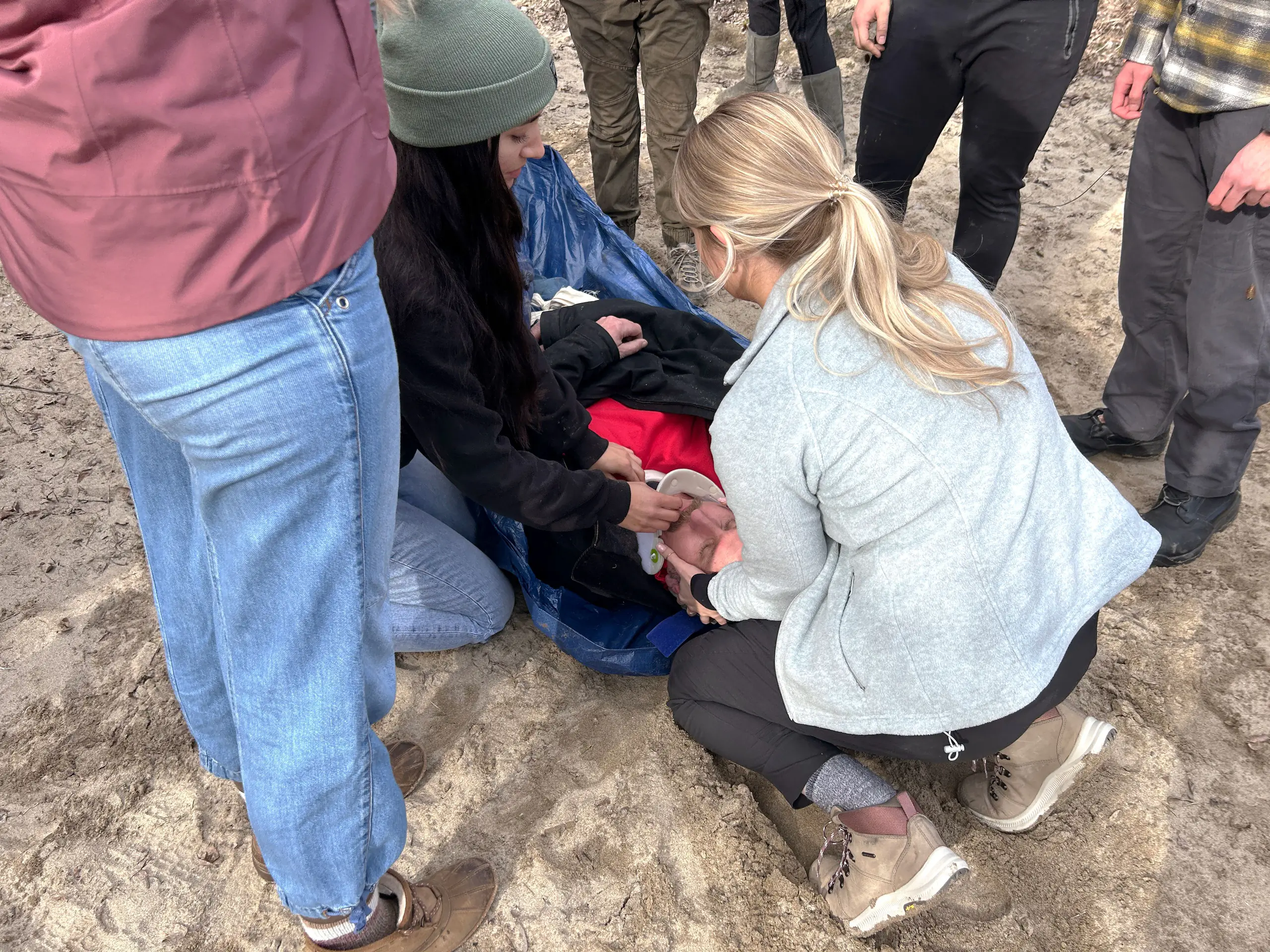 Idaho WWAMI students put a neck brace on a volunteer victim during a medical simulation