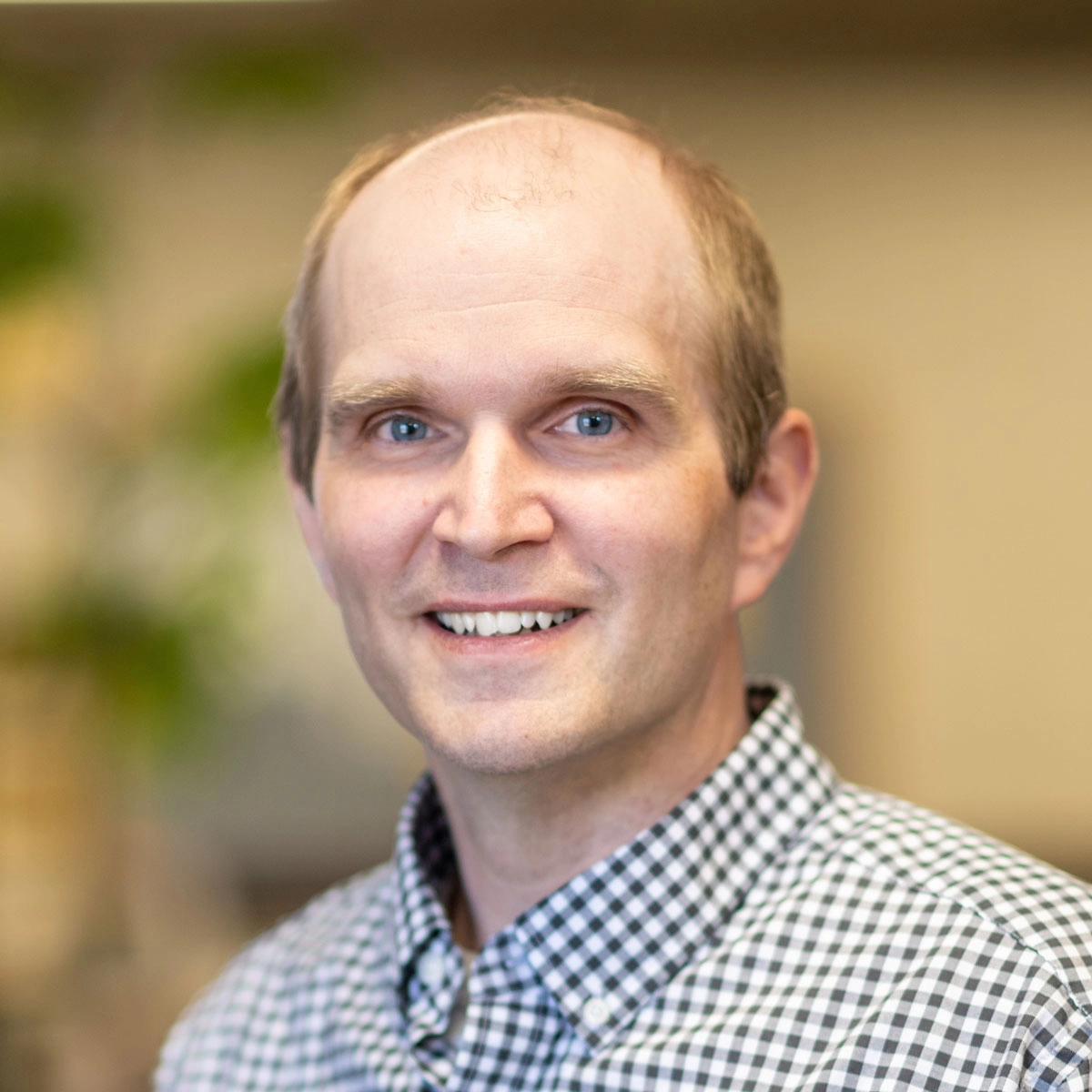 A man smiling at the camera