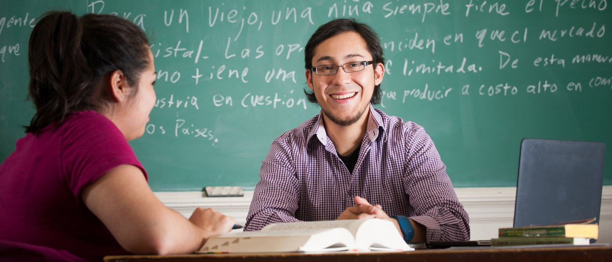 Two students conversing in the Admin Building.
