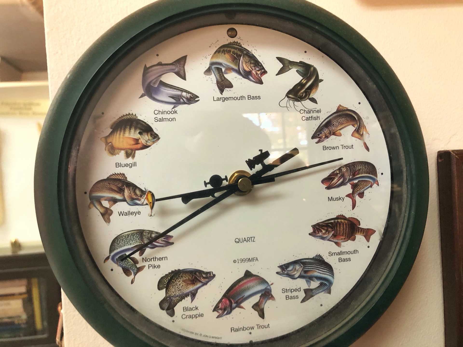 A fish clock on an office wall