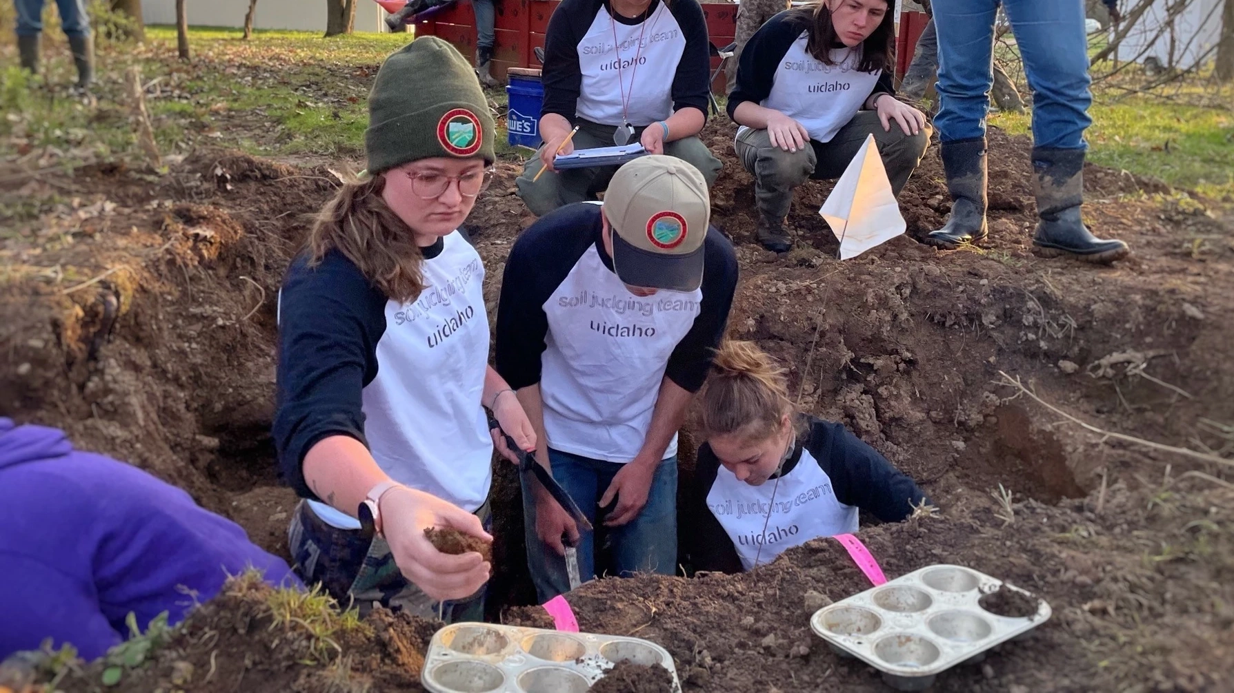 Students collecting soil for soil judging