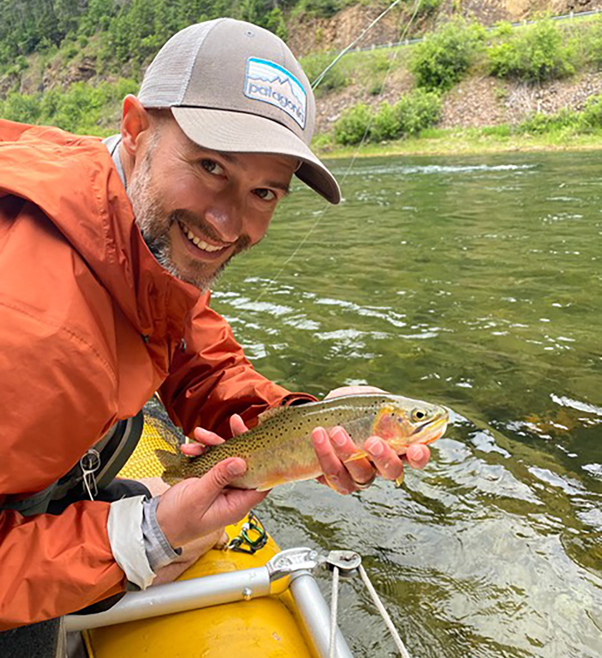 A man holds a fish.