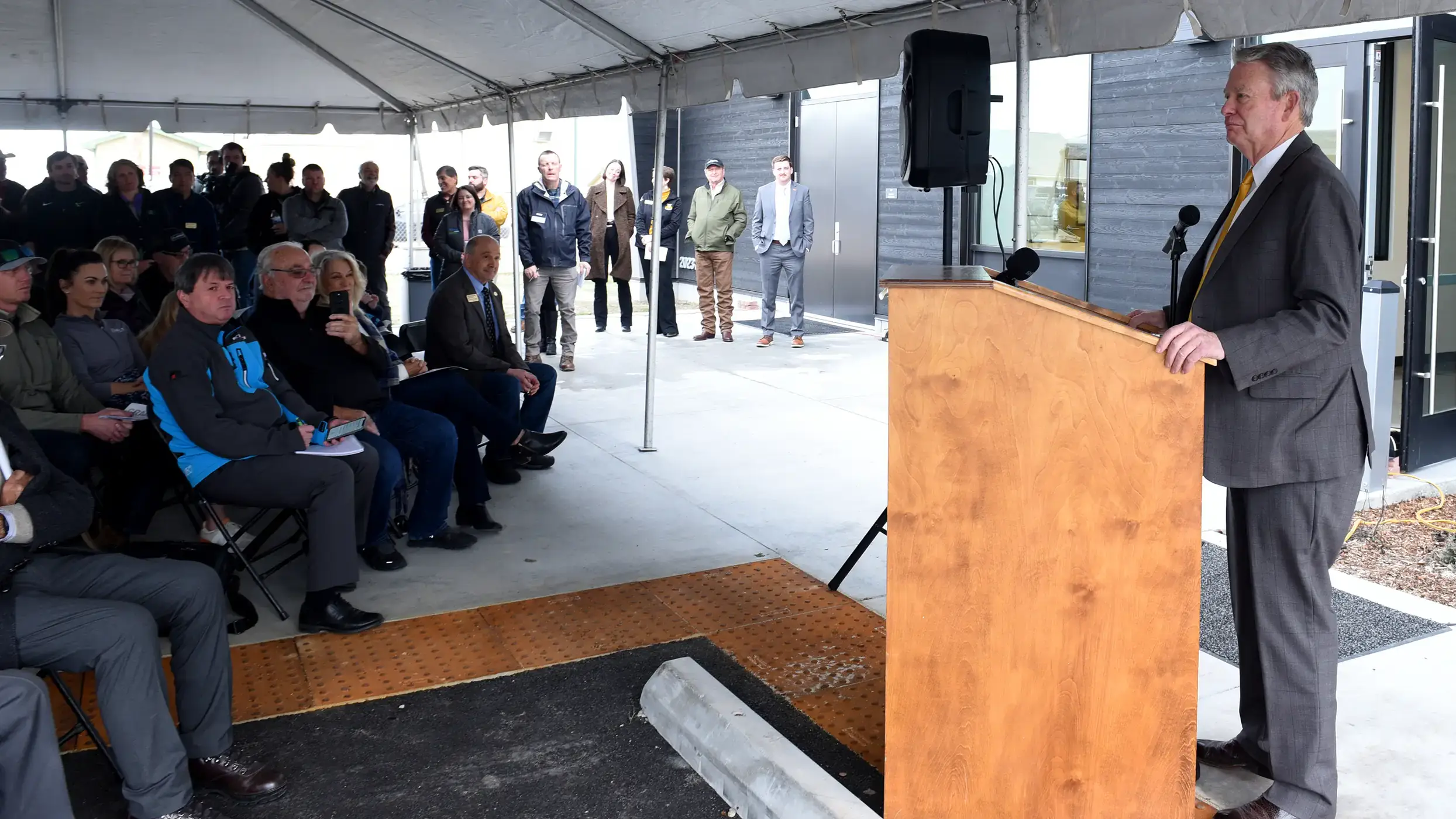 Parma faculty and staff gather as Gov. Brad Little gives a speech to stakeholders and the community at the center's opening.