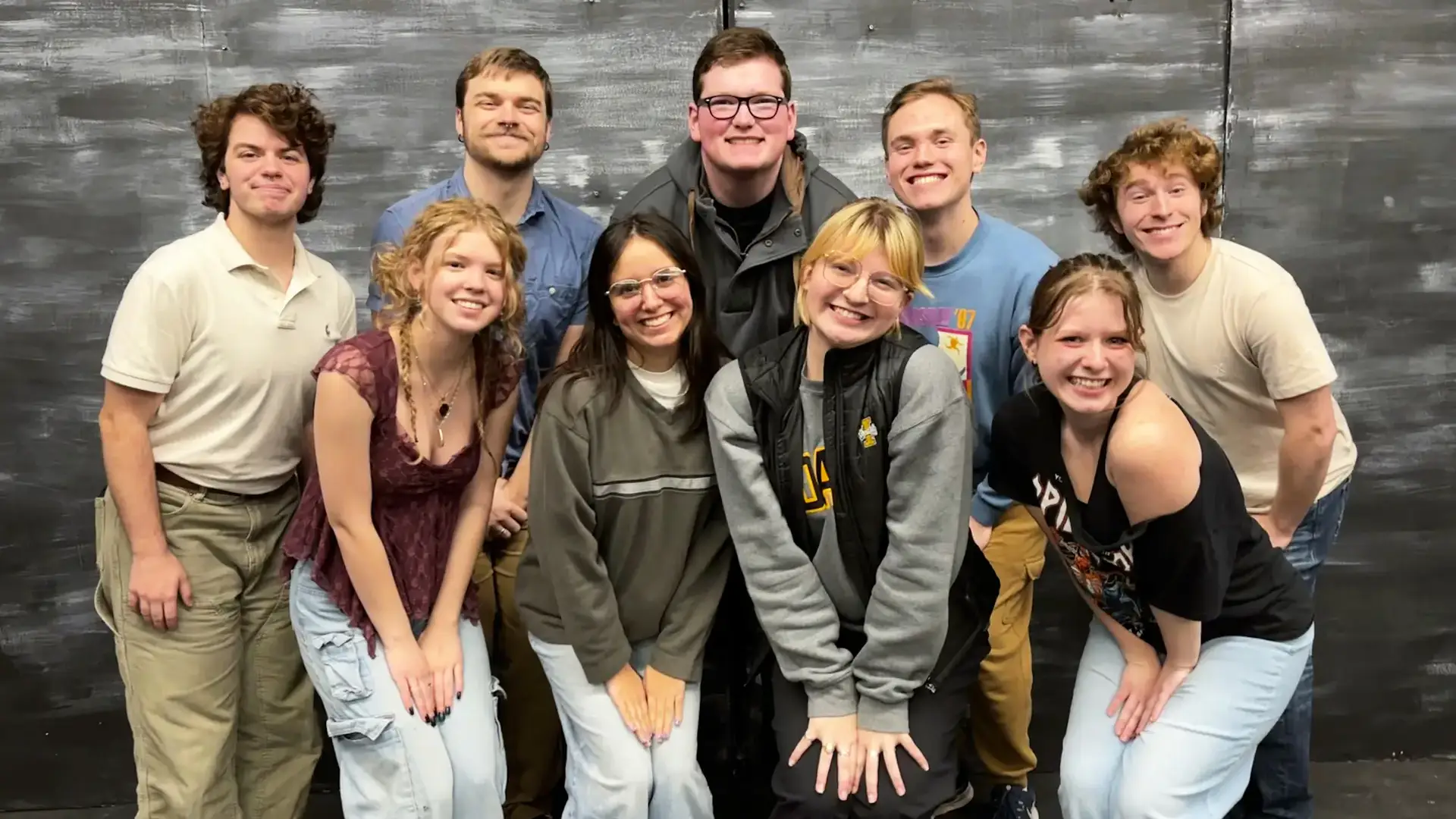 The cast of nine people in University of Idaho’s ‘Ride the Cyclone’ posing for a photo.