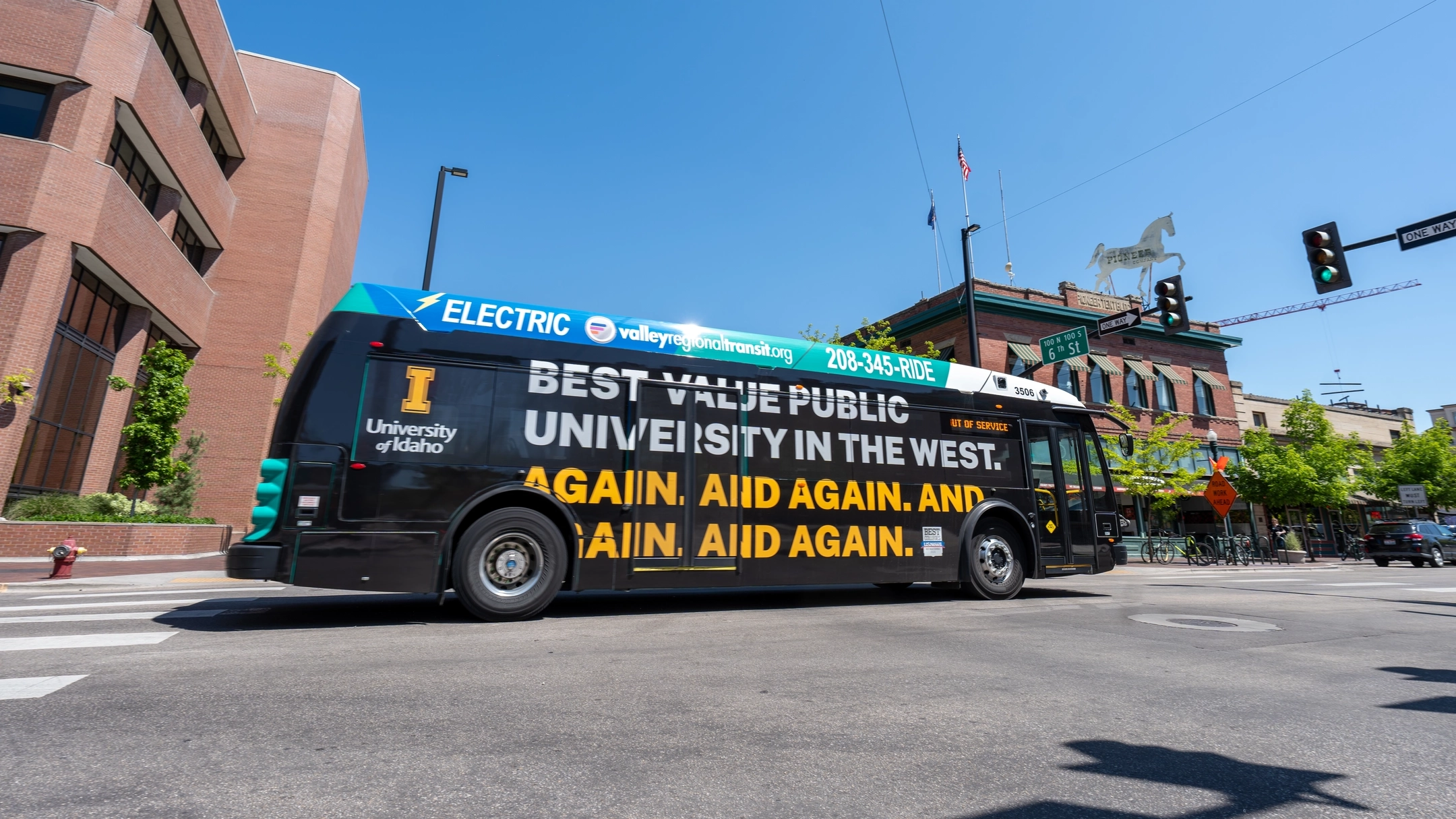 Valley Regional Transit buses are seen in downtown Boise, ID displaying University of Idaho advertisements Wednesday, April 30, 2025. Messaging includes “Best Value Public University in the West” and “The World Needs You”.