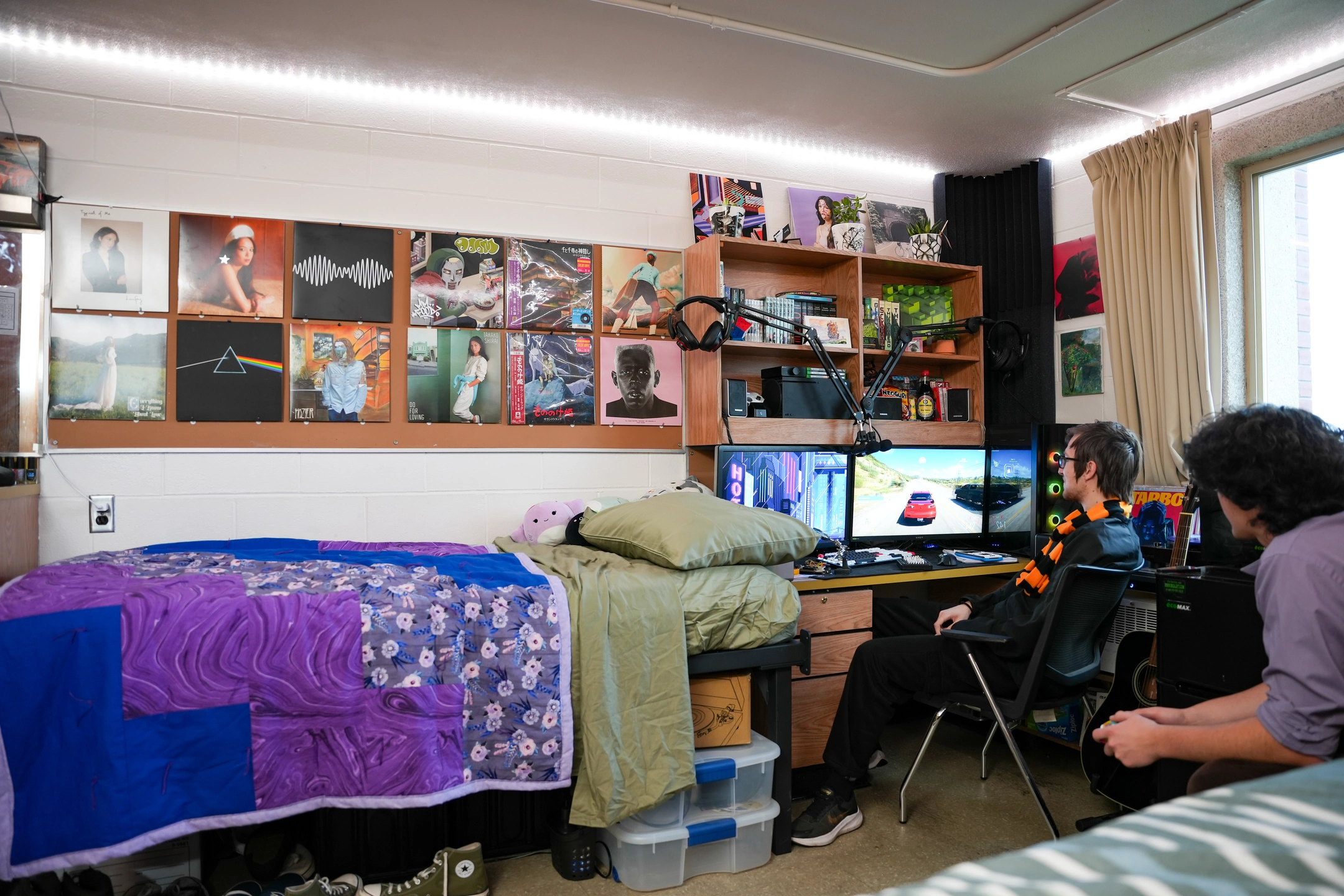 Two students relax in a dormitory room