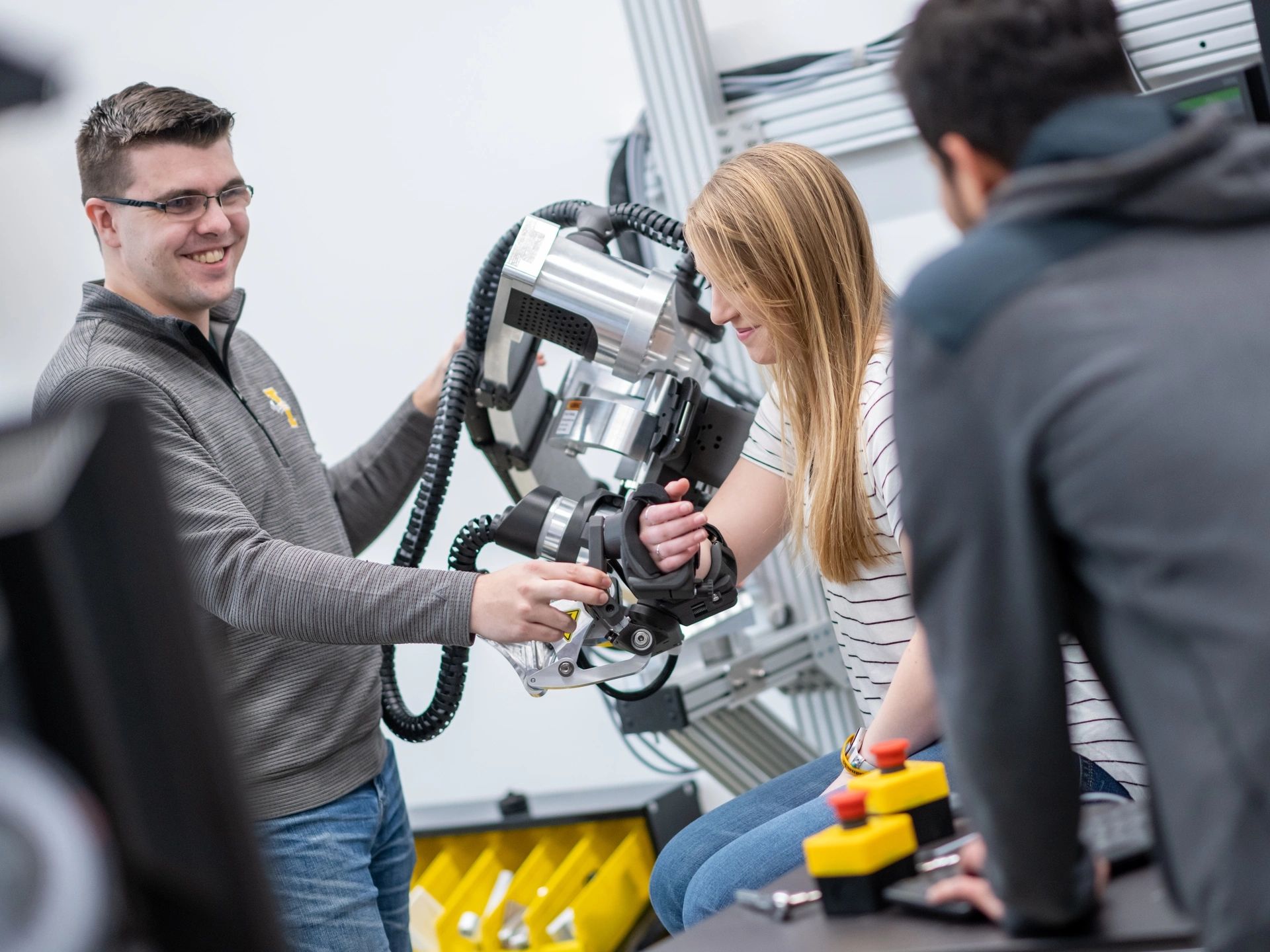 University of Idaho College of Engineering students and faculty working with therapeutic robots made to assist in physical therapy.