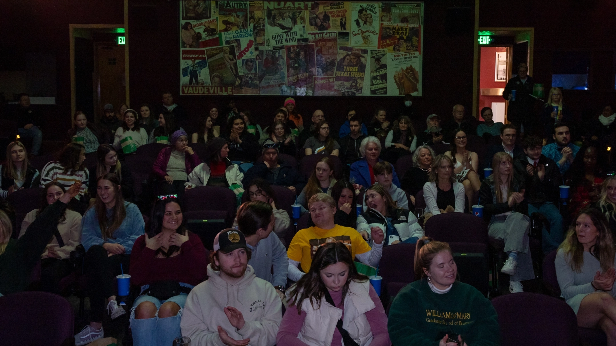 A group of people sitting in a theater