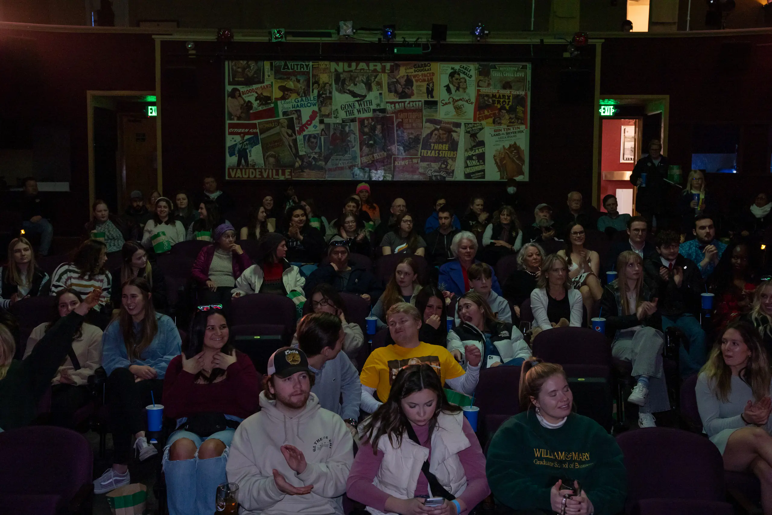 A group of people sitting in a theater