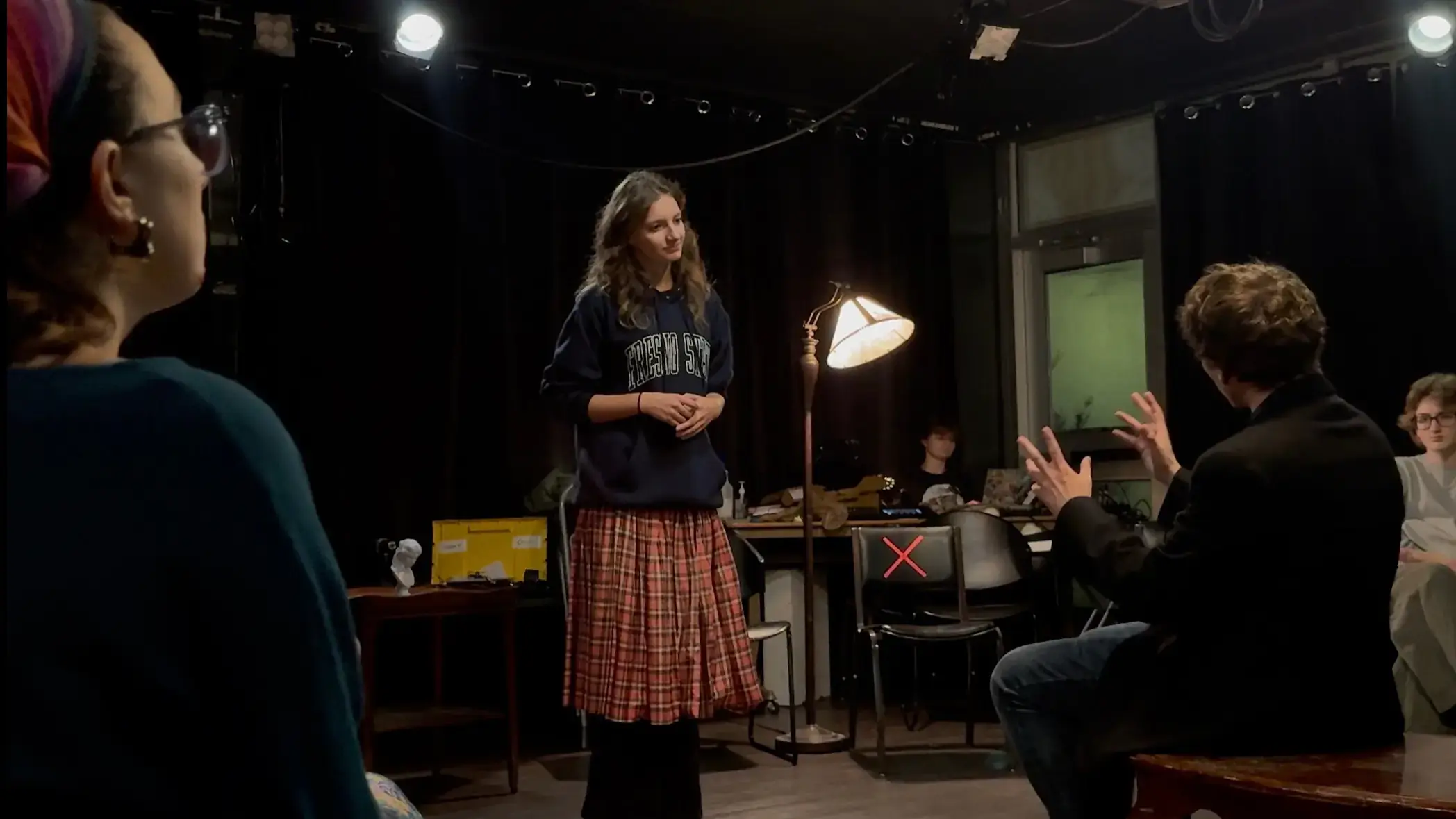 Alejandra Wagnon, Kasey Coddington and Bryce Gowey converse on stage.
