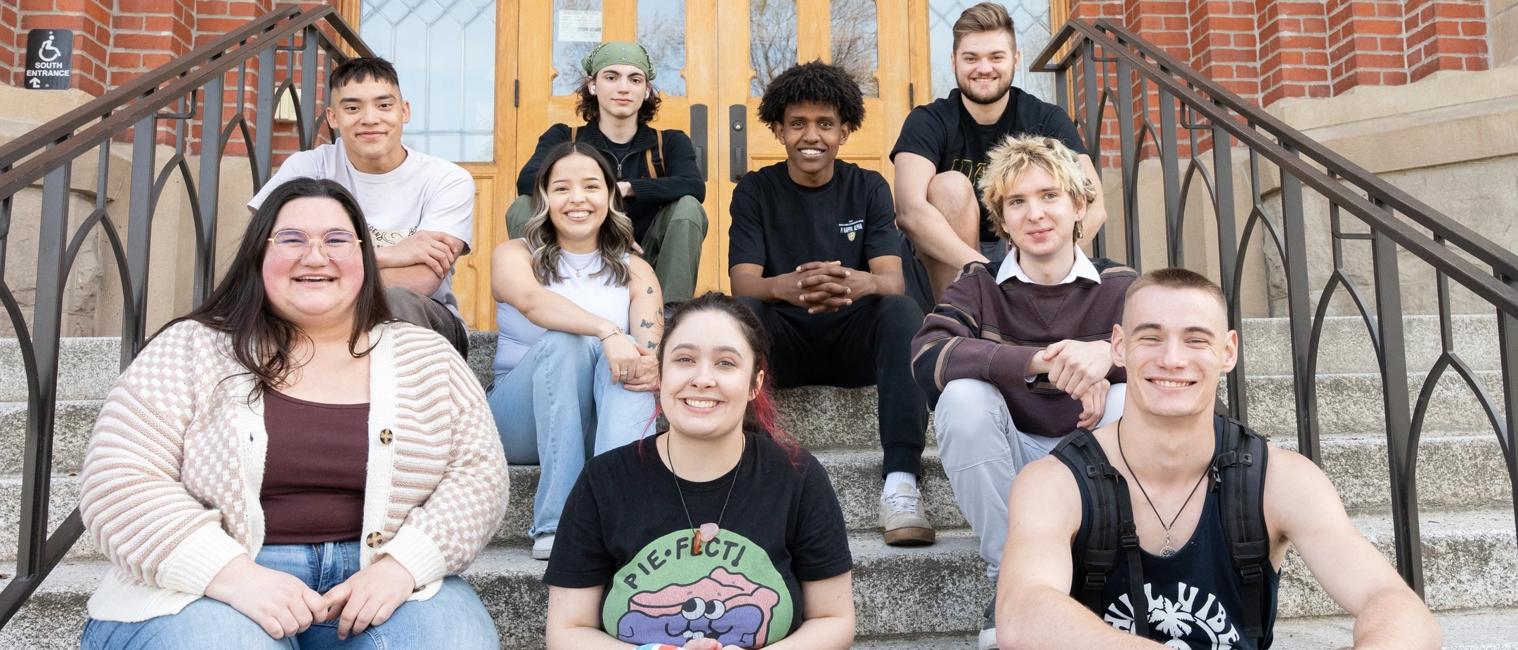Group portrait of student ambassadors for the Vandals Gateway Program on the Administration Building steps.