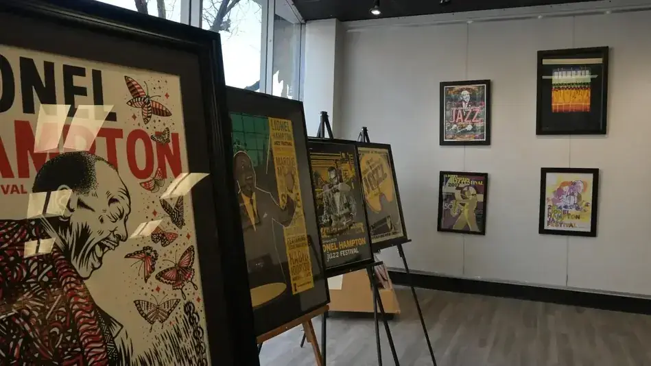 Framed Lionel Hampton Jazz Festival posters displayed on easels and a gallery wall.