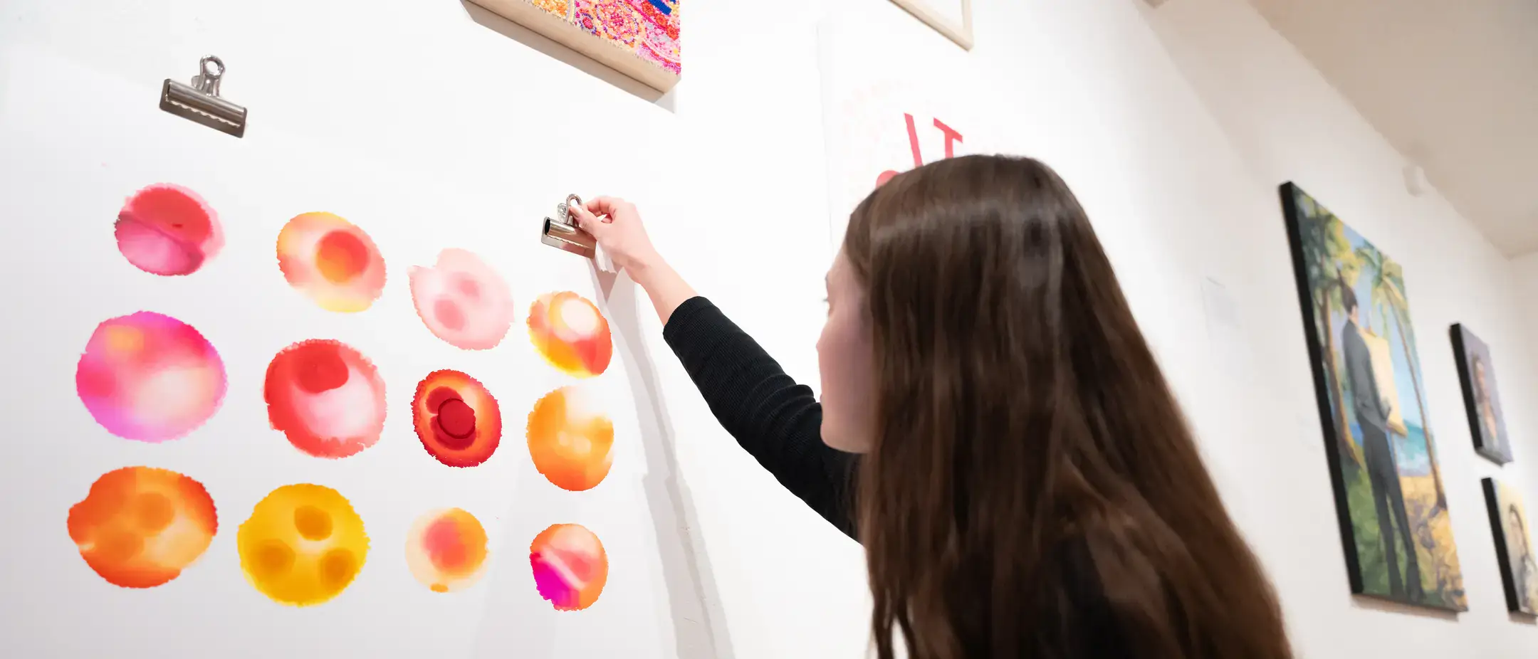 BFA/MFA2 Exhibition with students and student work in the Ridenbaugh Gallery