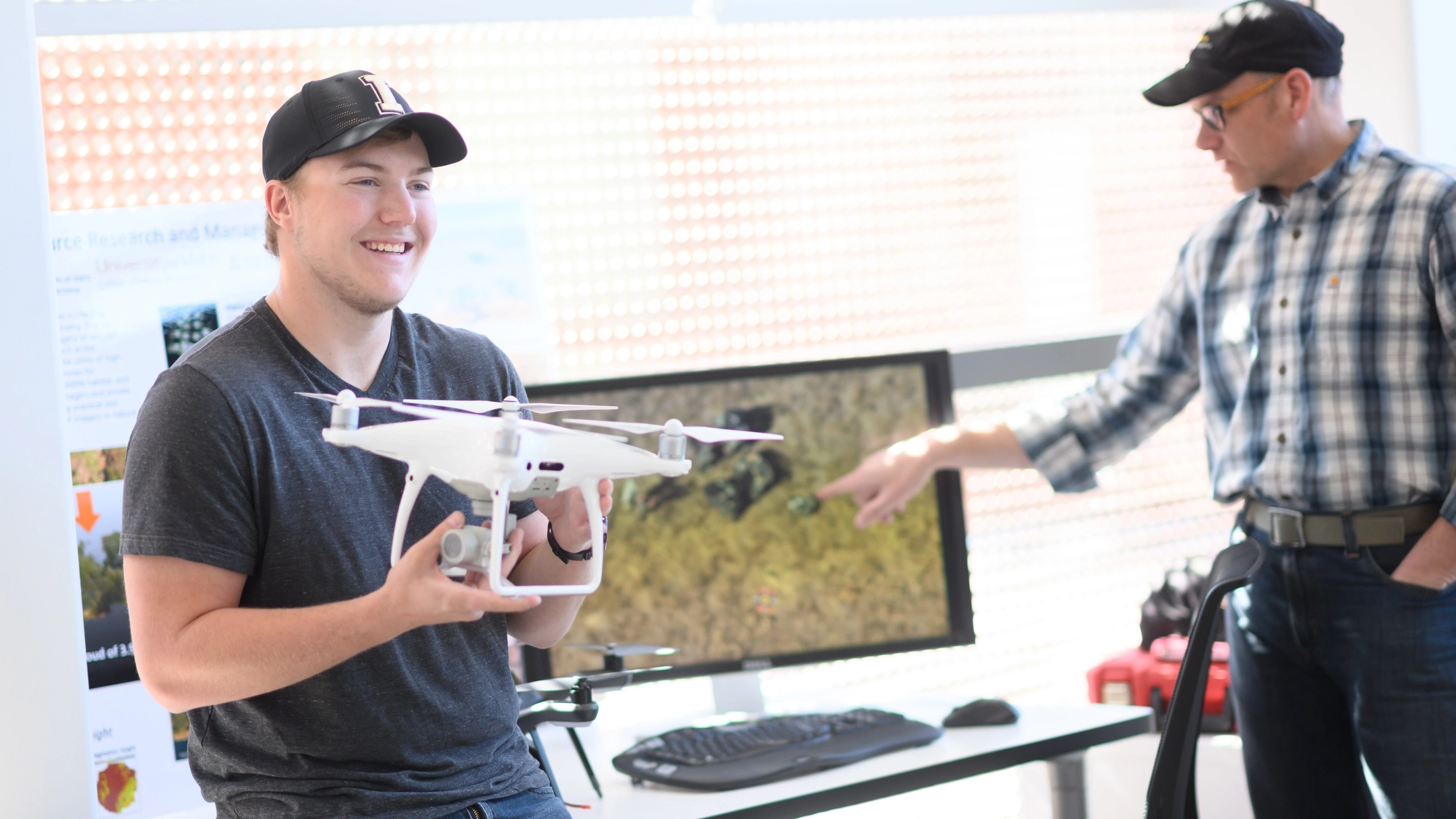 Student Dan Lauritzen working in the drone lab with Jason Karl for the College of Natural Resources