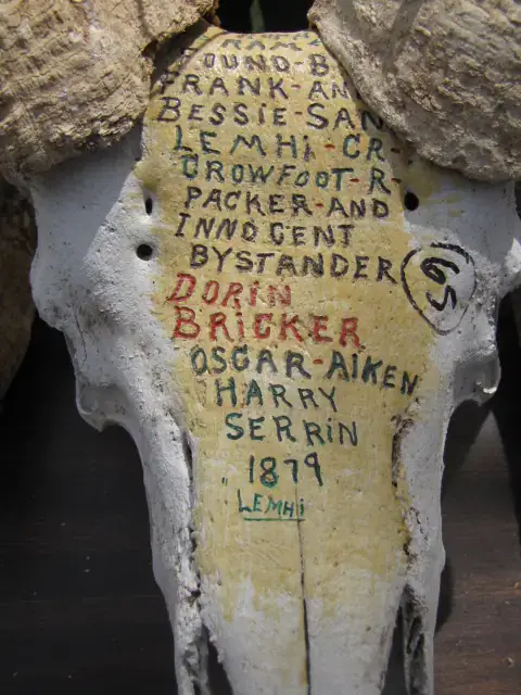 Sheep skull with writing on it. 
