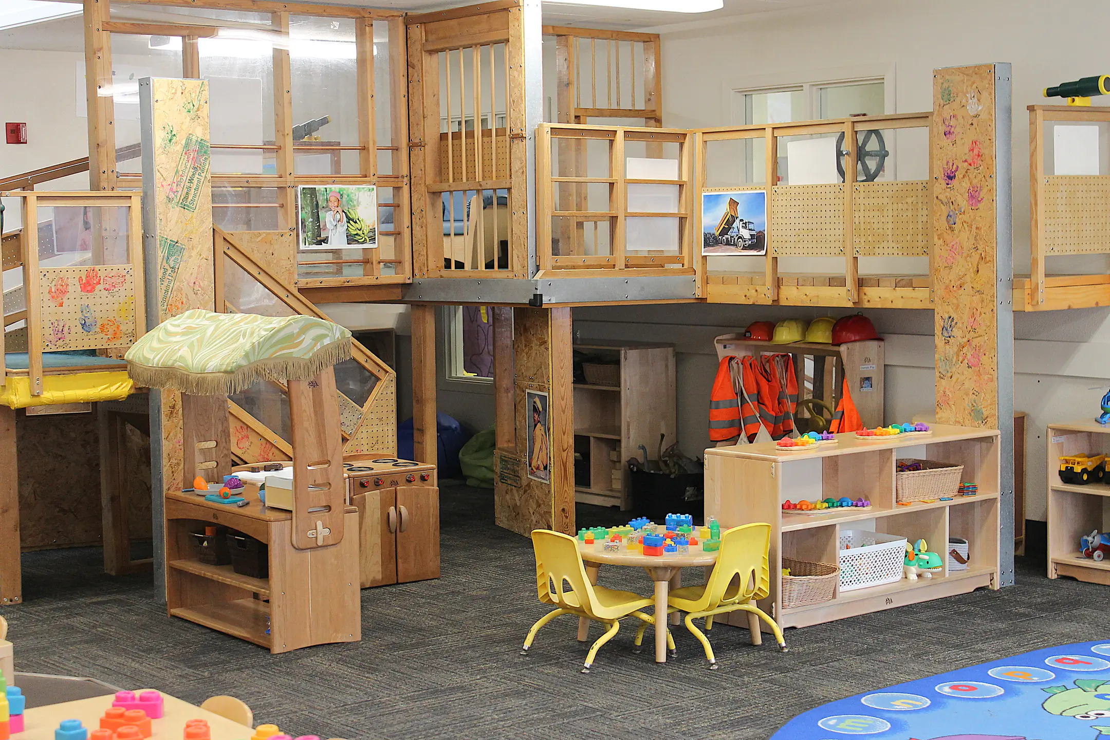 A play area with jungle gym and reading corner.
