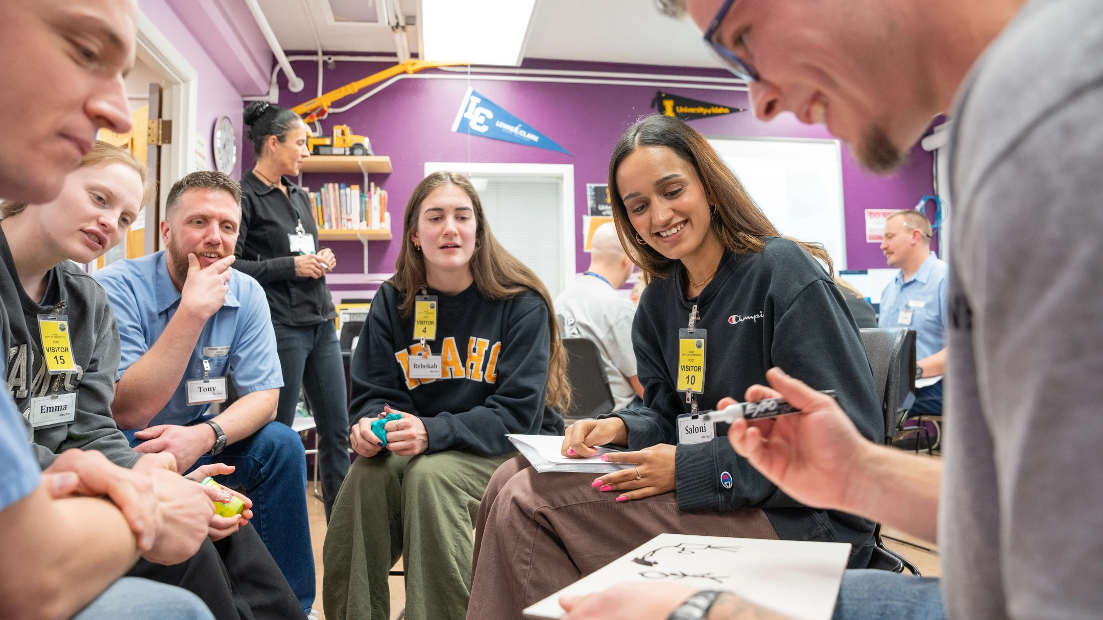 UIdaho and incarcerated students broken up into small groups for discussions