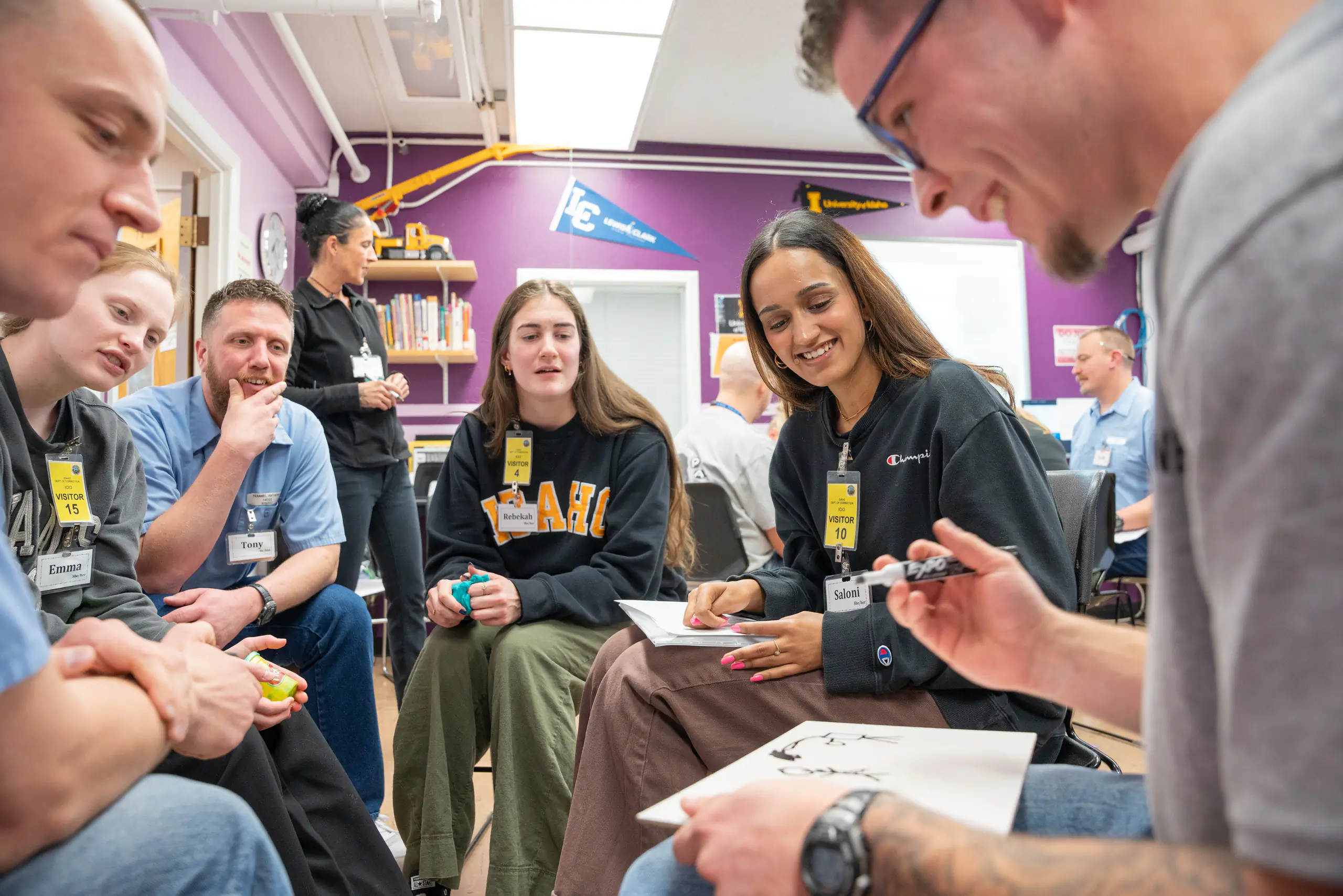 UIdaho and incarcerated students broken up into small groups for discussions