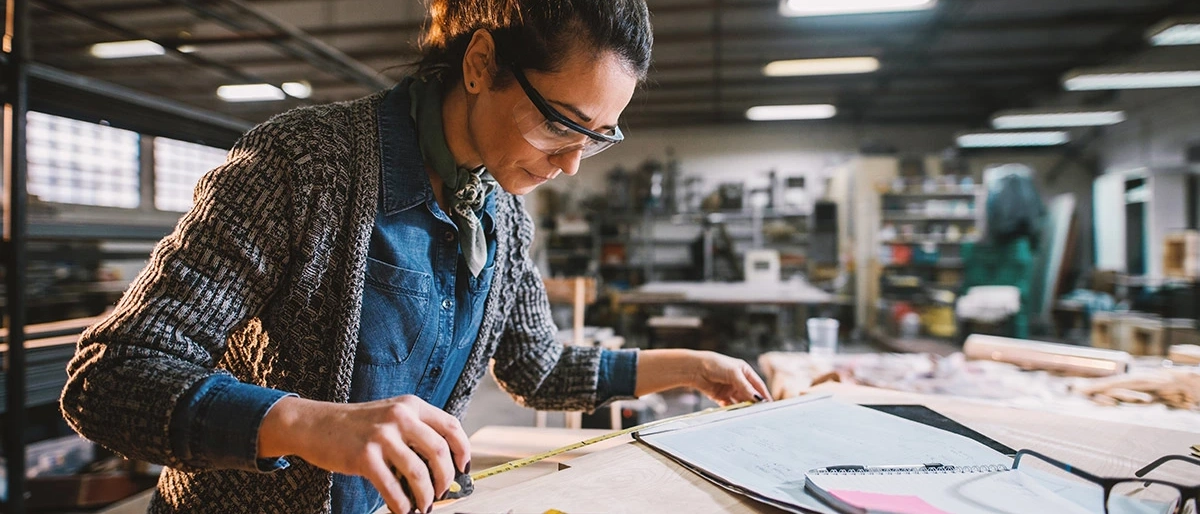 Woman working as engineer at table