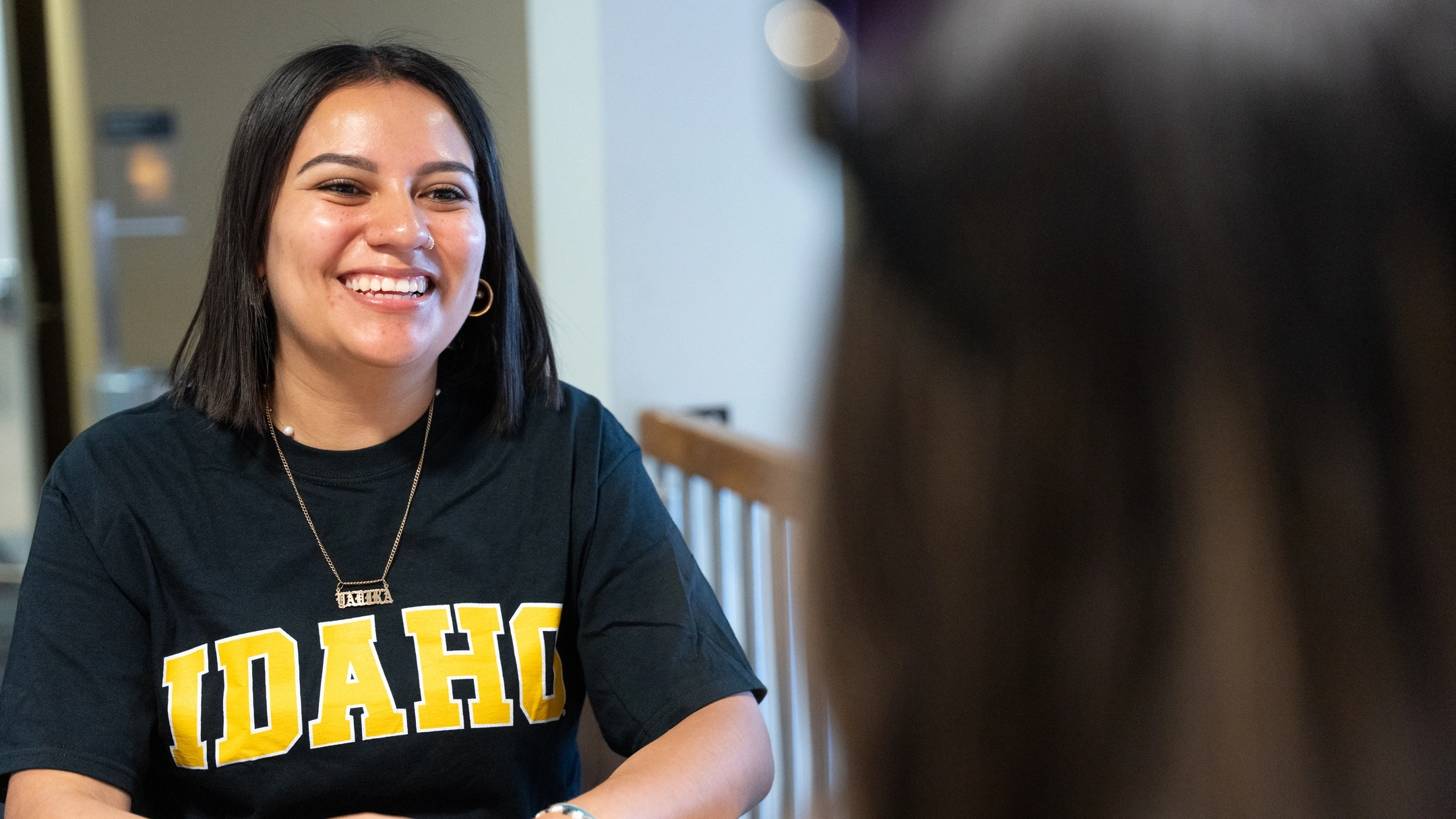 Student recieves advising from College Assistance Migrant Program (CAMP)  Advising Specialist, Alondra Ibarra, at the UIdaho Bound event on the Ӱֱ campus, June 14th, 2024