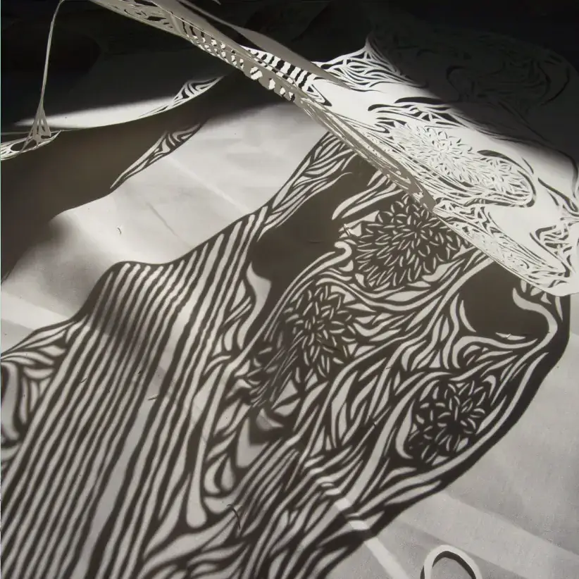 Black and white linocut print of flowers by Lauren McCleary