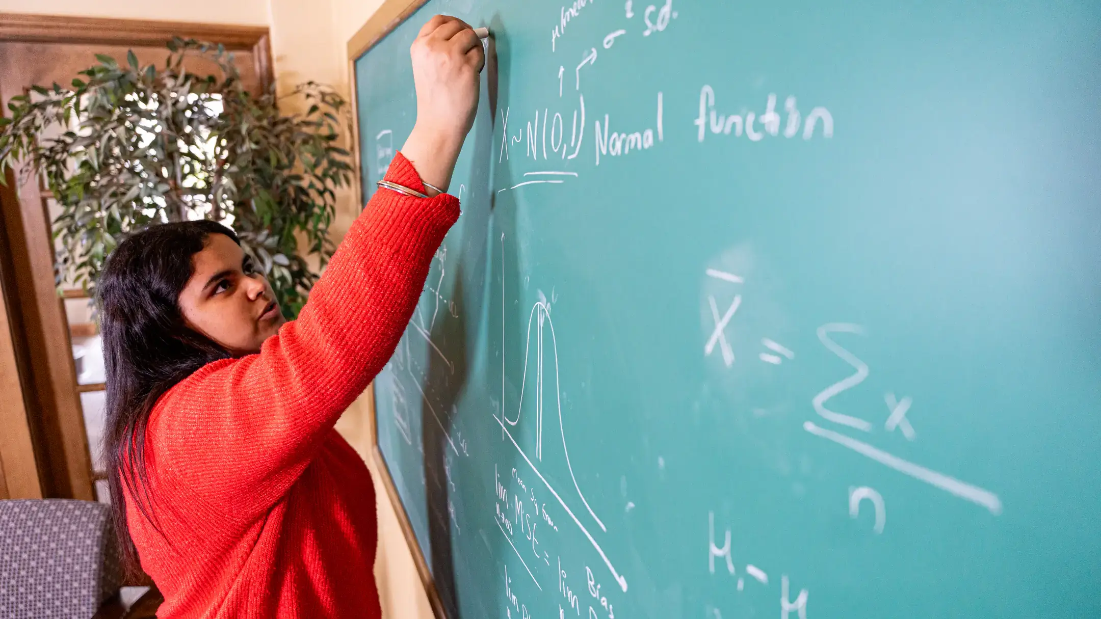 Graduation story on Avneet Virk, a Mathematics and Statistical Science student, who is pictured in Brink Hall on March 27, 2025.