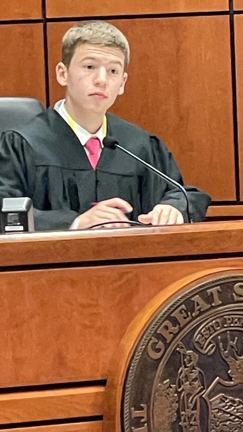 Portraits of students in a court room