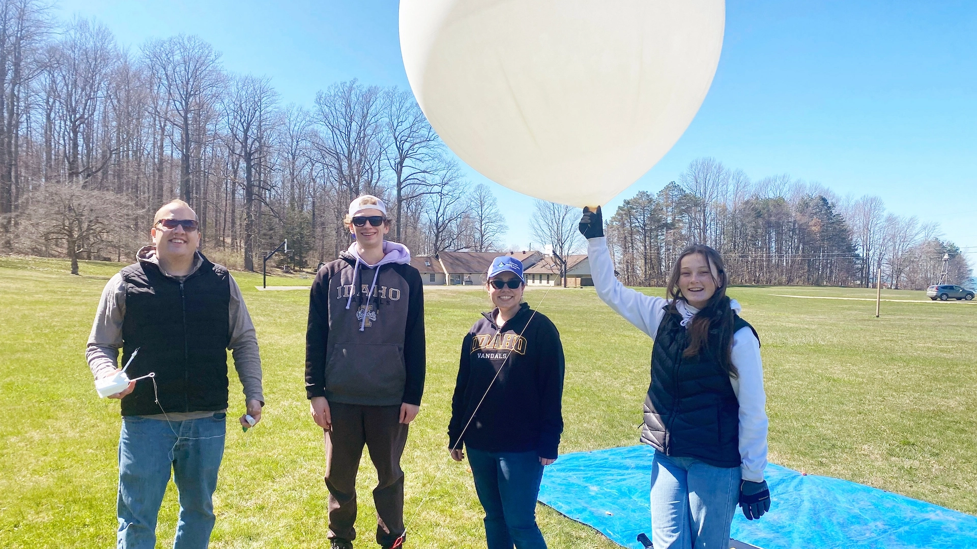 University of Idaho College of Engineering students launch weather balloons during the total eclipse in North Springfield, Pennsylvania, to help NASA gather data needed to improve global weather forecast models and climate change mitigation processes