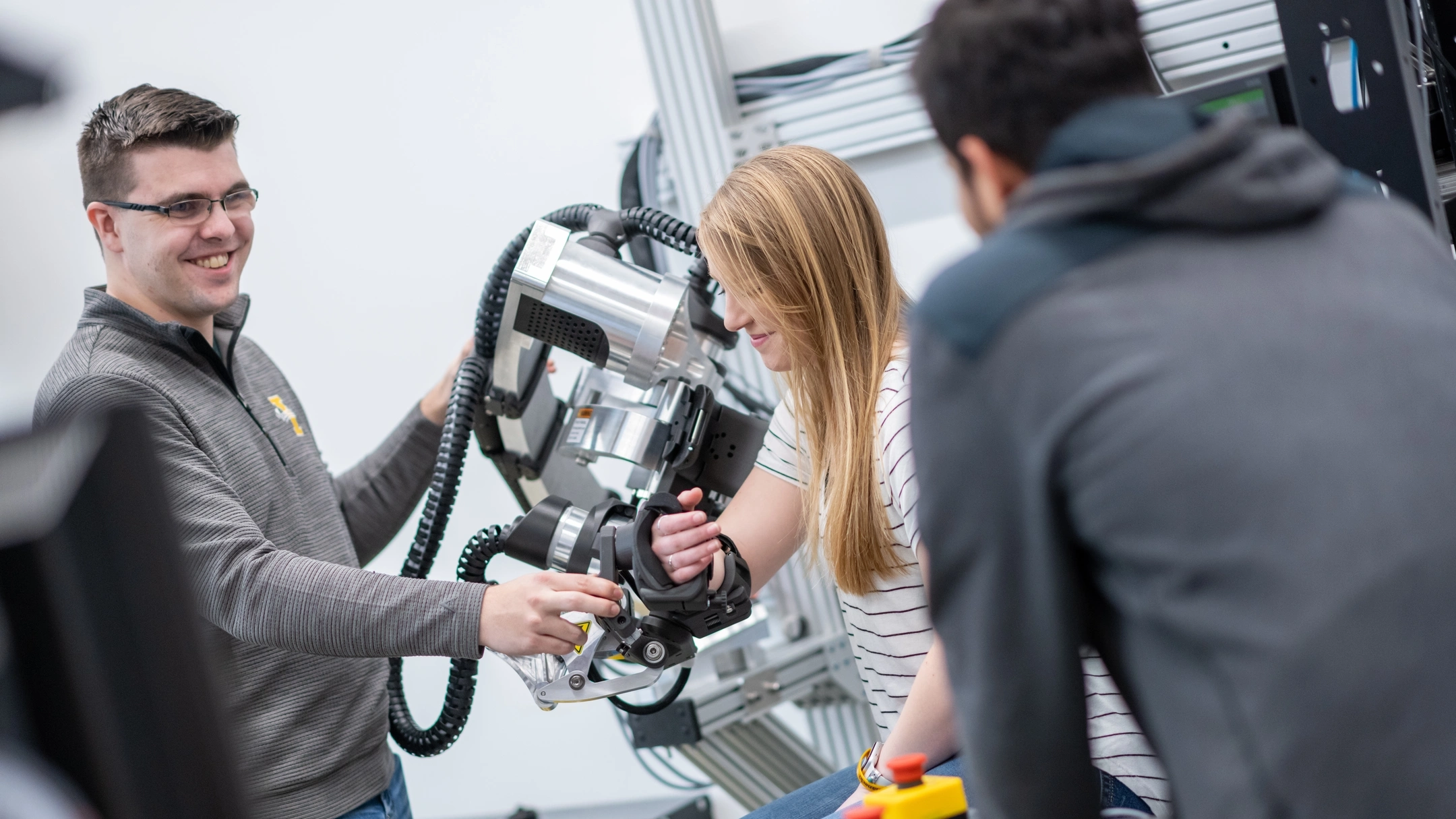 University of Idaho College of Engineering students and faculty working with therapeutic robots made to assist in physical therapy.